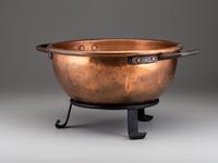 A Copper and Wrought Iron Bowl and Two Spun Brass Buckets