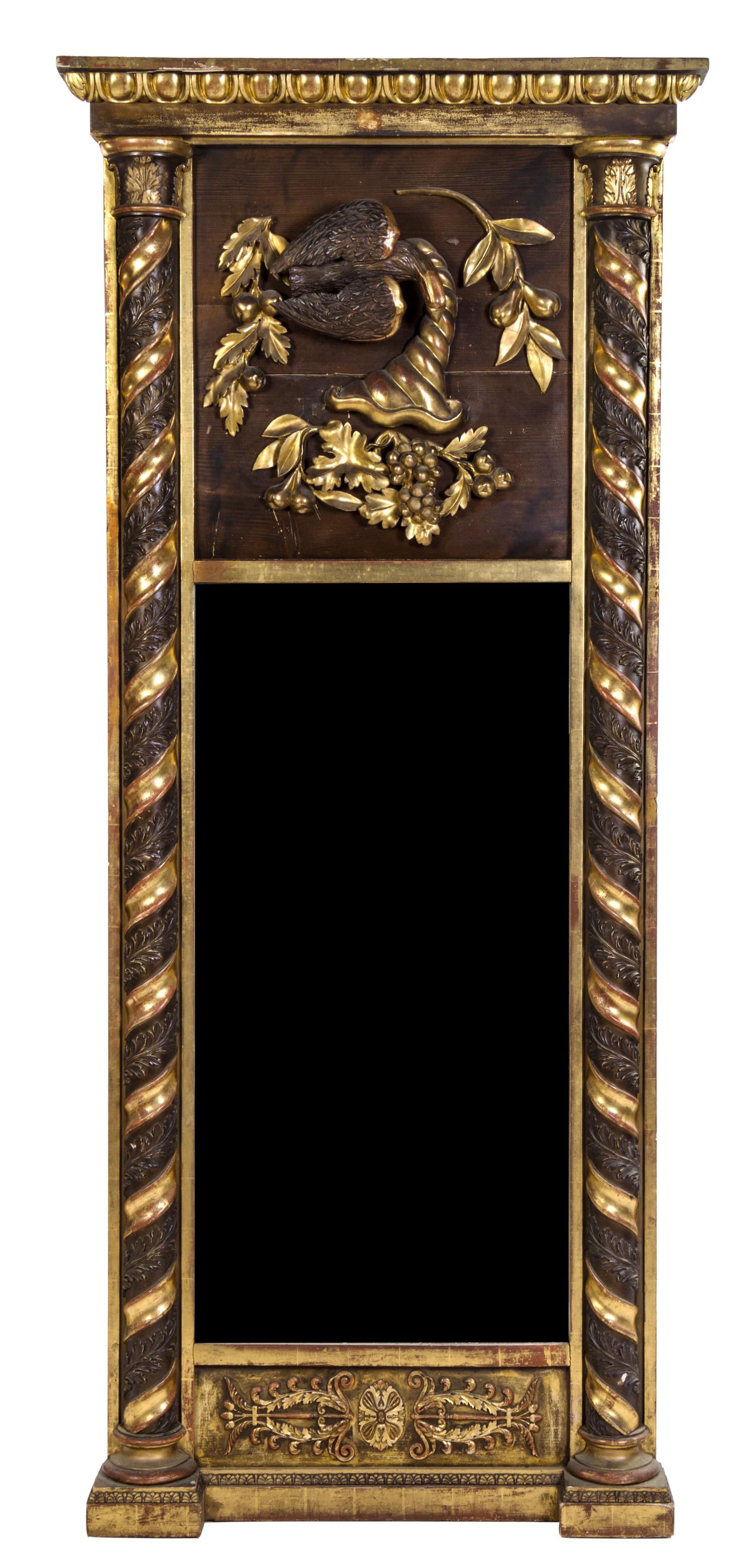 An Italian Carved and Parcel Gilt Pier Mirror Height 76 1/2 x width 32 1/2 inches. — LATE 19TH CENTURY