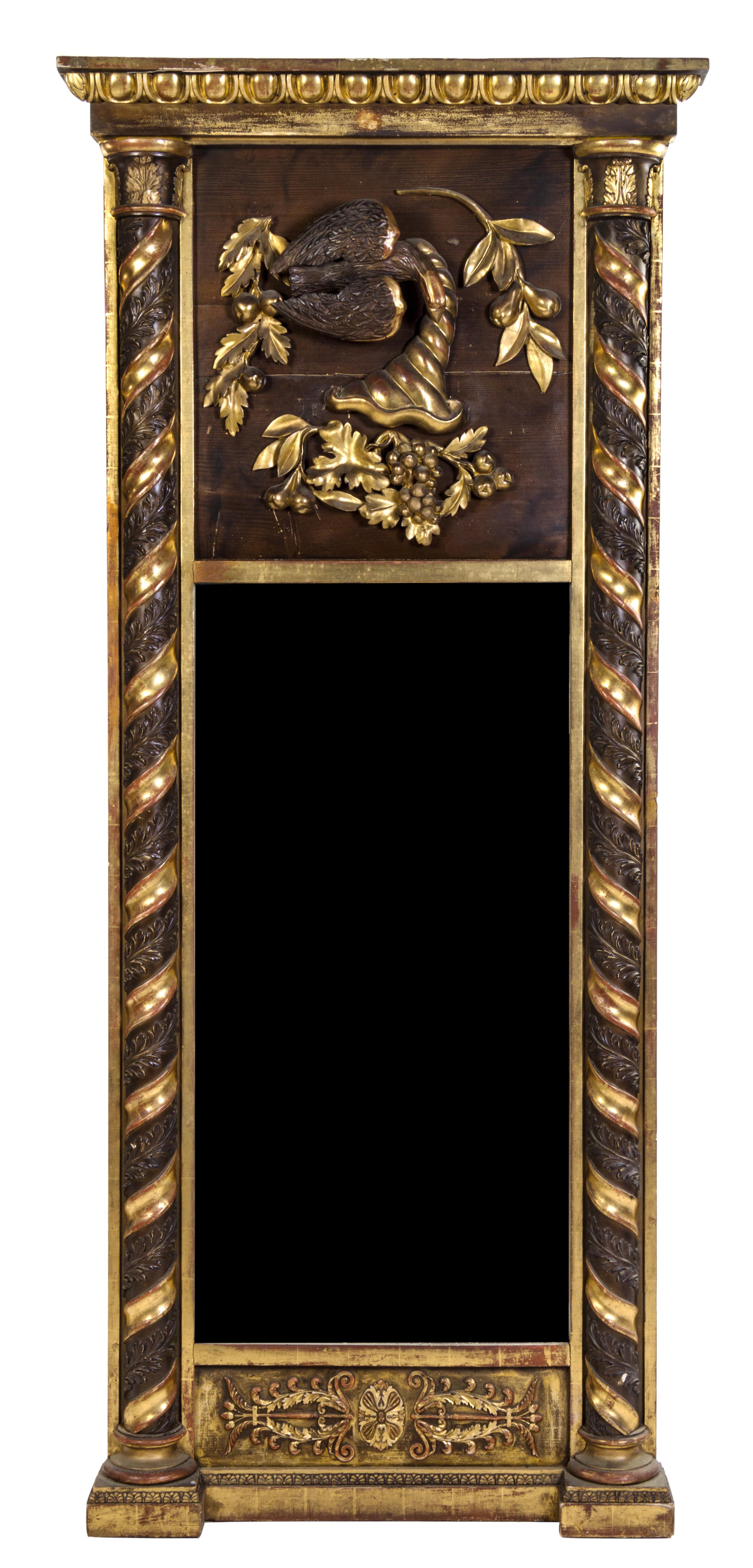 An Italian Carved and Parcel Gilt Pier Mirror Height 76 1/2 x width 32 1/2 inches. — LATE 19TH CENTURY