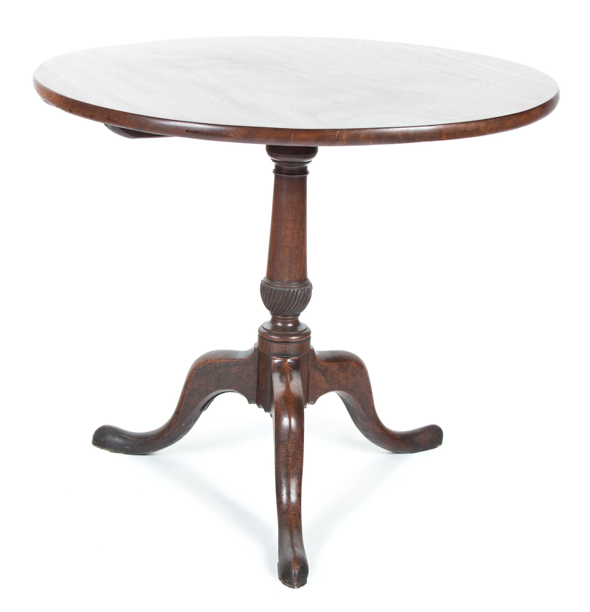 A George II Style Mahogany Tilt-Top Table Height 27 x diameter 32 inches. — 20TH CENTURY