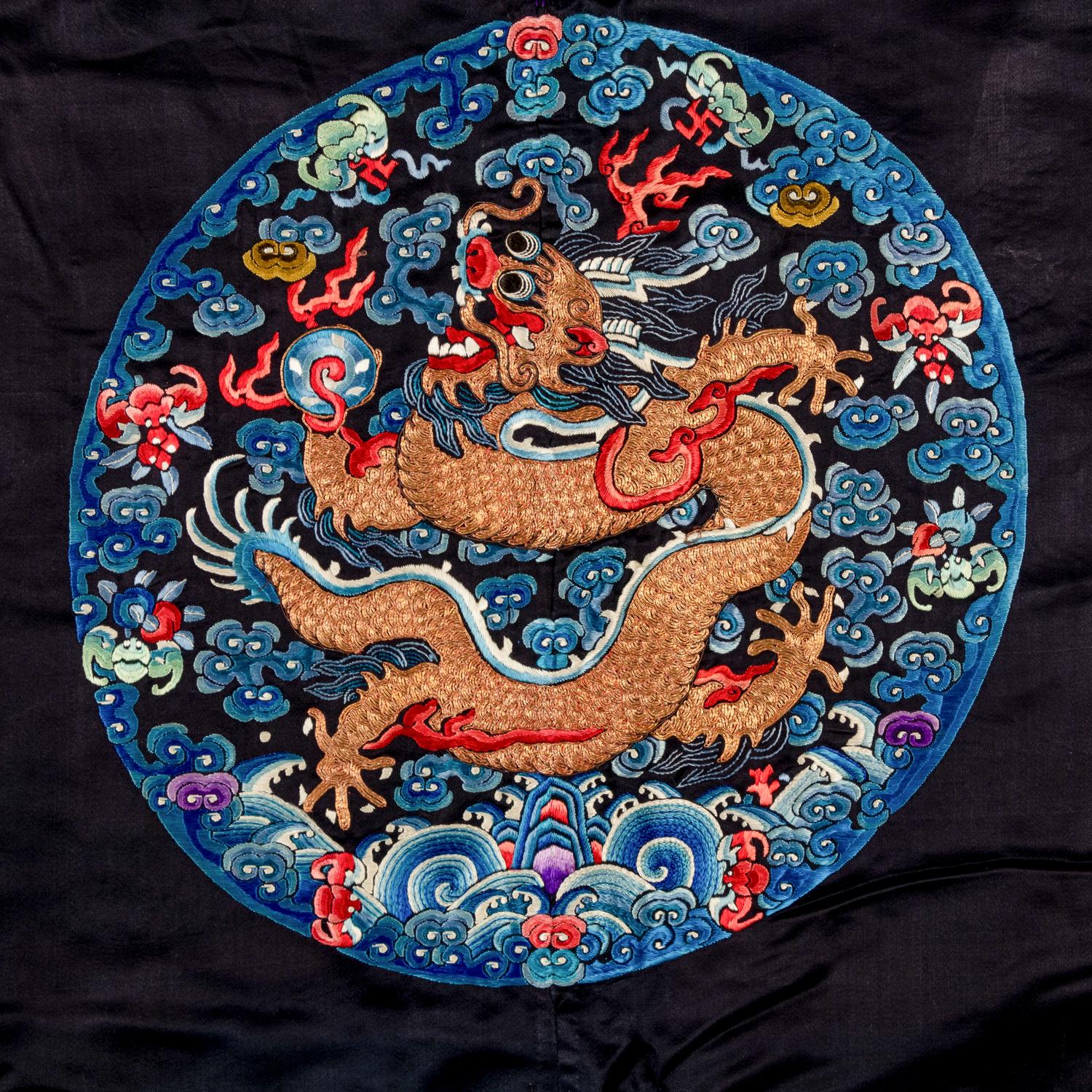 A Chinese Dark Navy Ground Embroidered Silk 'Dragon' Robe, 19th Century 清晚期 石青緞繡八團五爪龍褂