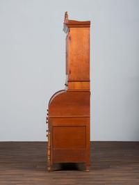 A Late Federal Cherry Wood and Tiger Maple Roll-Top Desk-and-Bookcase
