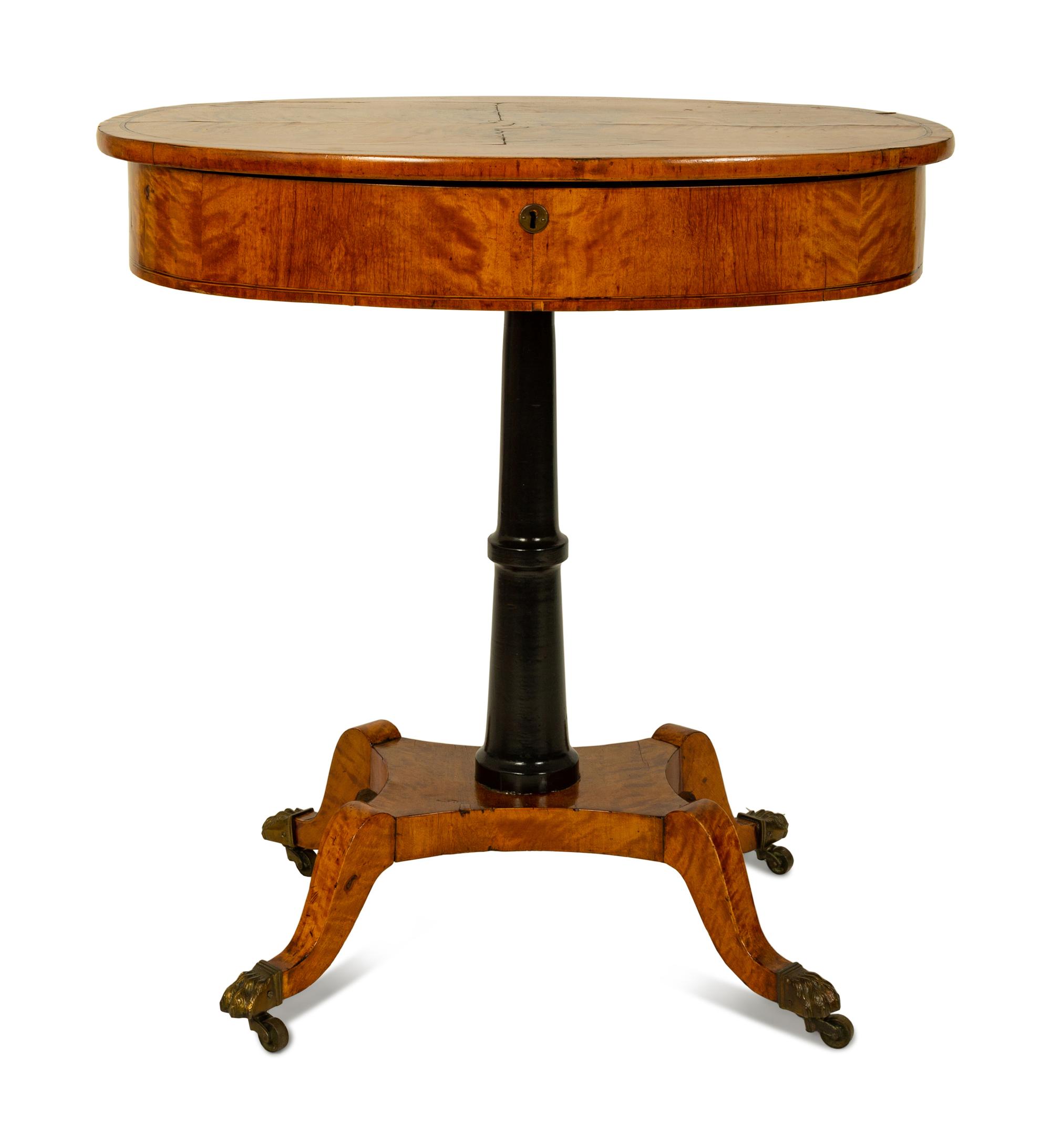 A Regency Inlaid Satinwood, Ebonized and Parcel Gilt Oval Work Table — EARLY 19TH CENTURY