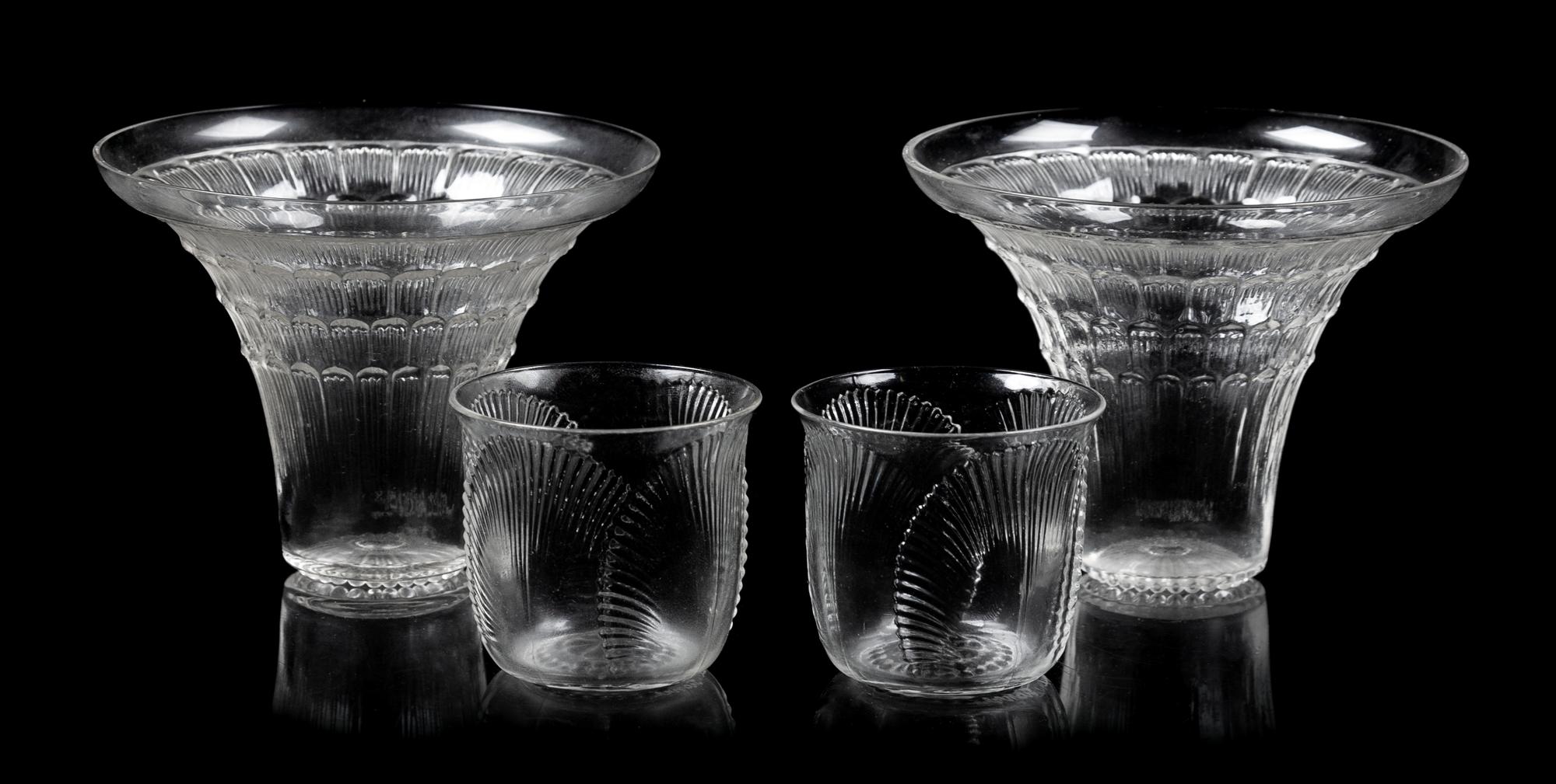 A Pair of Lalique Glasses and a Pair of Shot Glasses Height of tallest 3 1/8 inches.