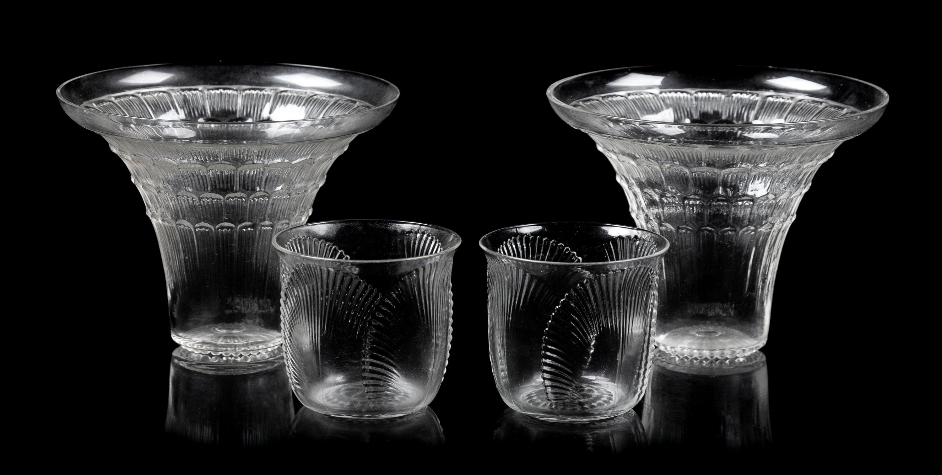 A Pair of Lalique Glasses and a Pair of Shot Glasses Height of tallest 3 1/8 inches.