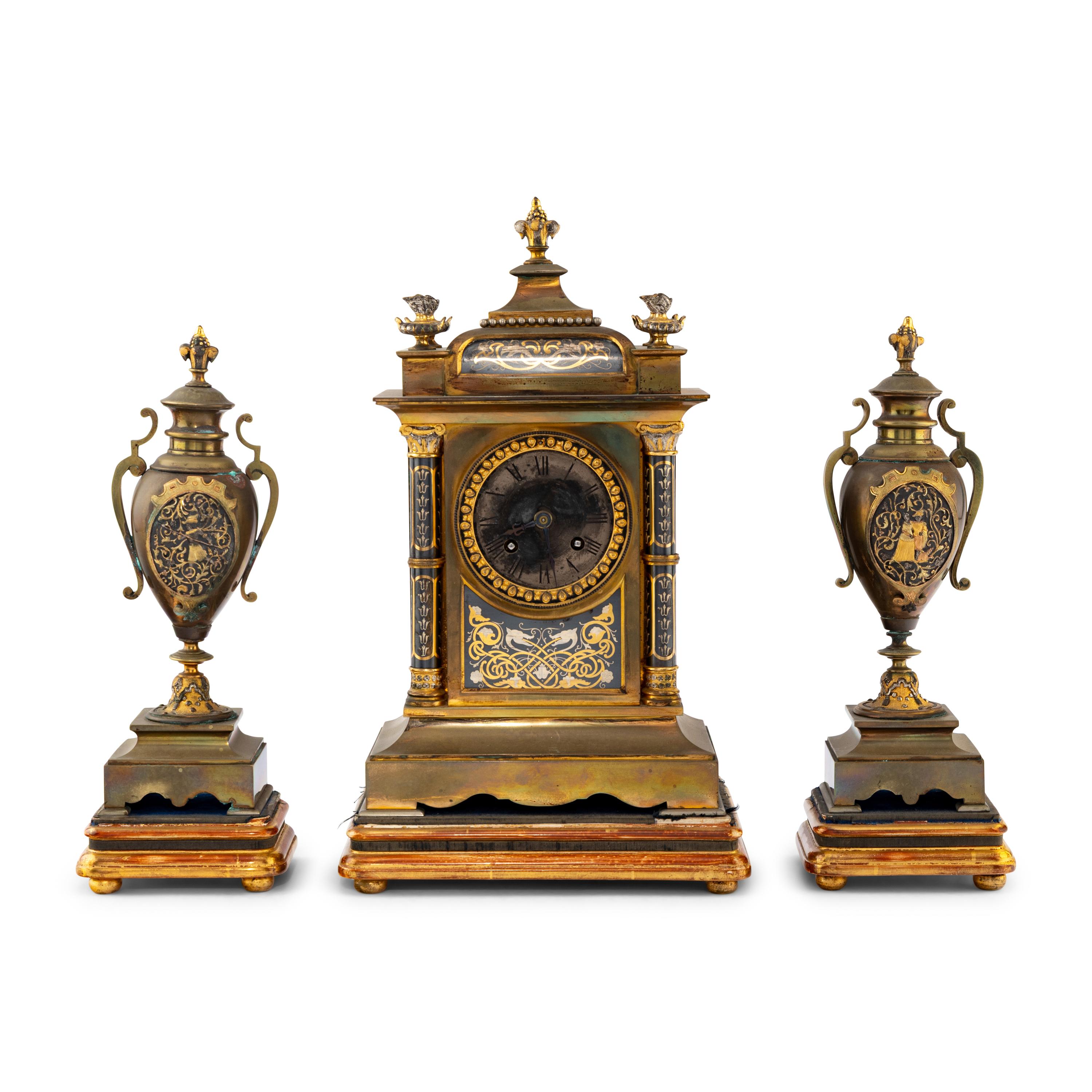 A French Brass and Mixed Metals Clock Garniture