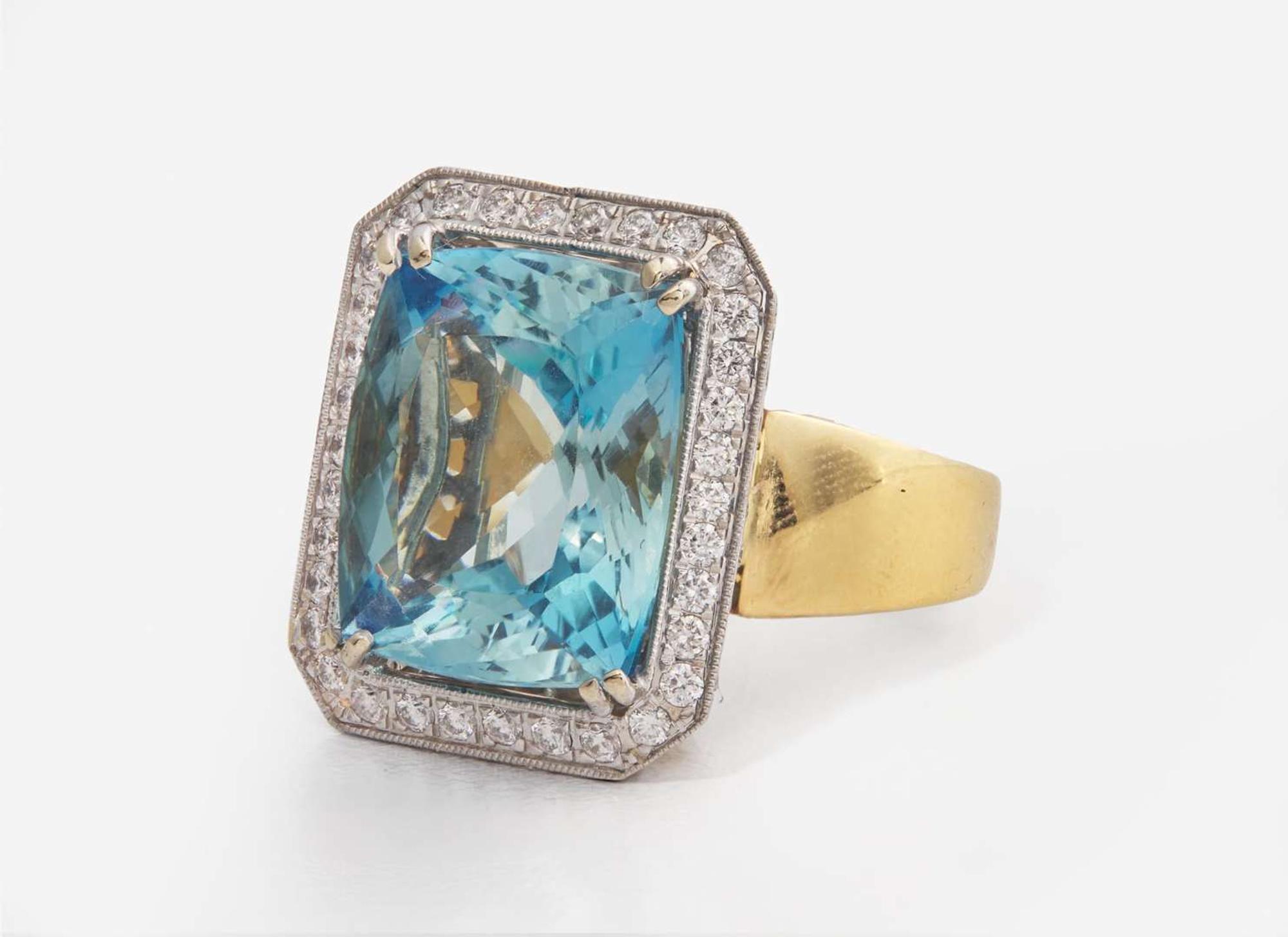 An 18K Gold, Aquamarine, and Diamond Ring