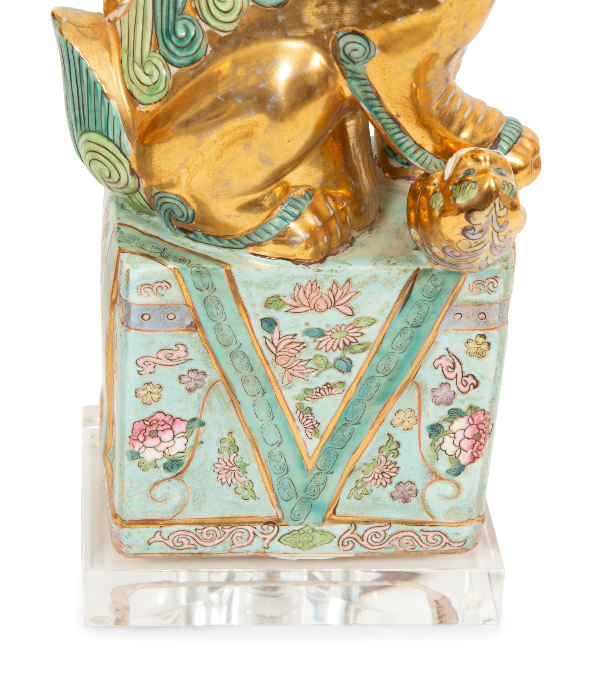 A Pair of Chinese Porcelain Foo Dog Table Lamps