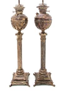 A Pair of Victorian Silver-Plate Oil Lamps, Height 28 1/4 inches.