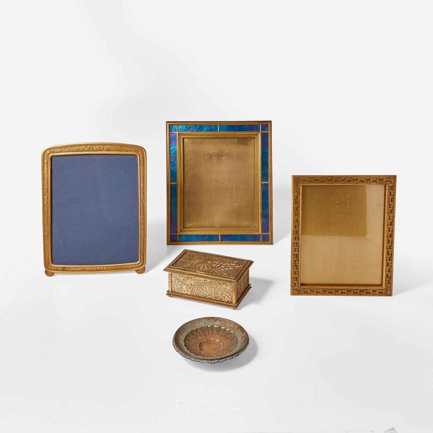 Tiffany Studios (American, active 1878-1932) and Louis C. Tiffany Furnaces, Inc. (American, active 1920-1928) A Group of Five Gilt Bronze, Brass or Glass Table Items, New York, NY, early 20th century
