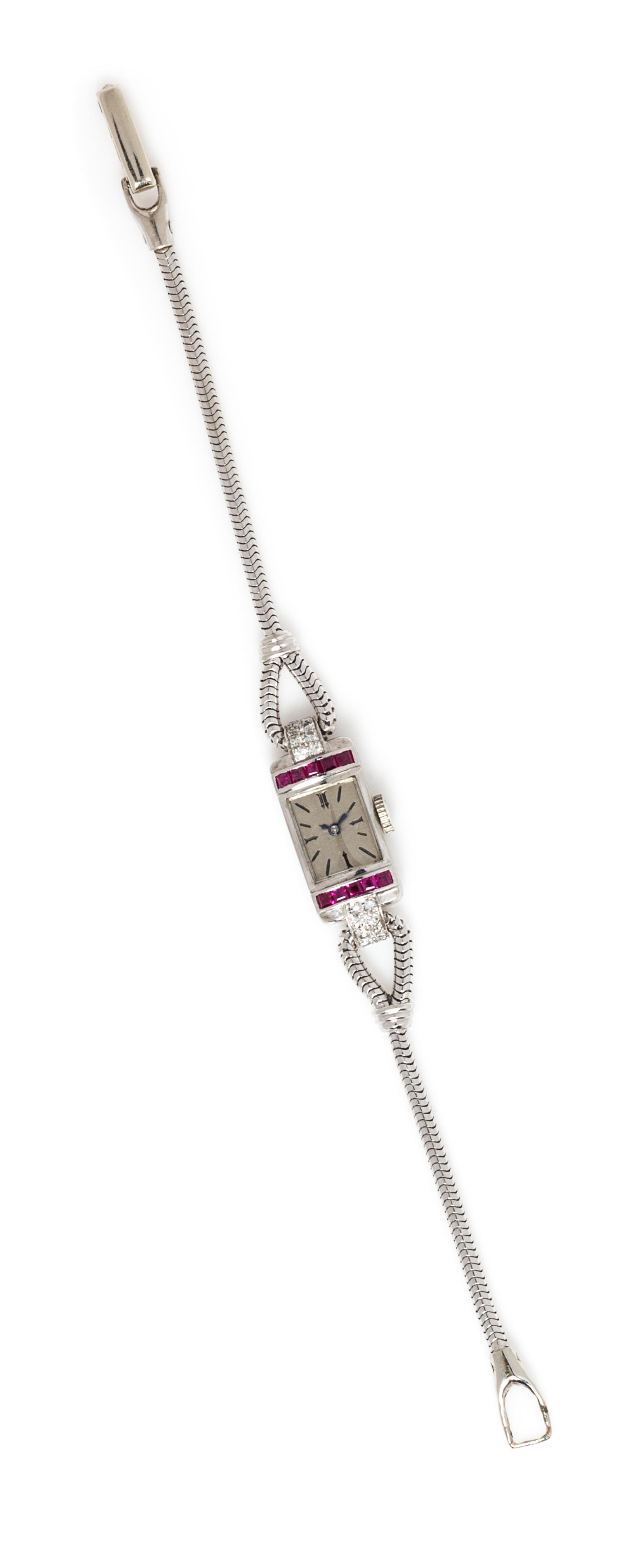 An 18 Karat White Gold, Ruby and Diamond Wristwatch, Movado Factories, 9.60 dwts.