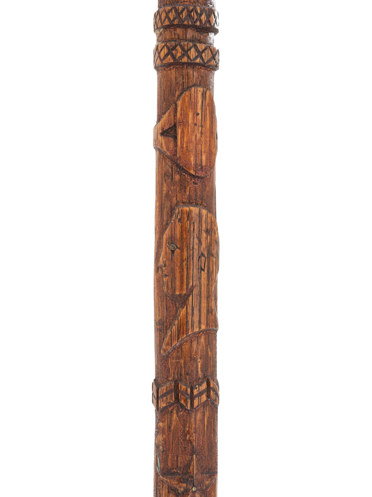 [CIVIL WAR]. GAR folk art carved cane featuring corps badges and patriotic motifs.