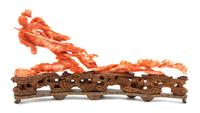 A Chinese Carved Coral Figure of an Immortal Floating on Clouds Height 12 x width 6 1/4 x depth 2 1/2 inches. — 20TH CENTURY