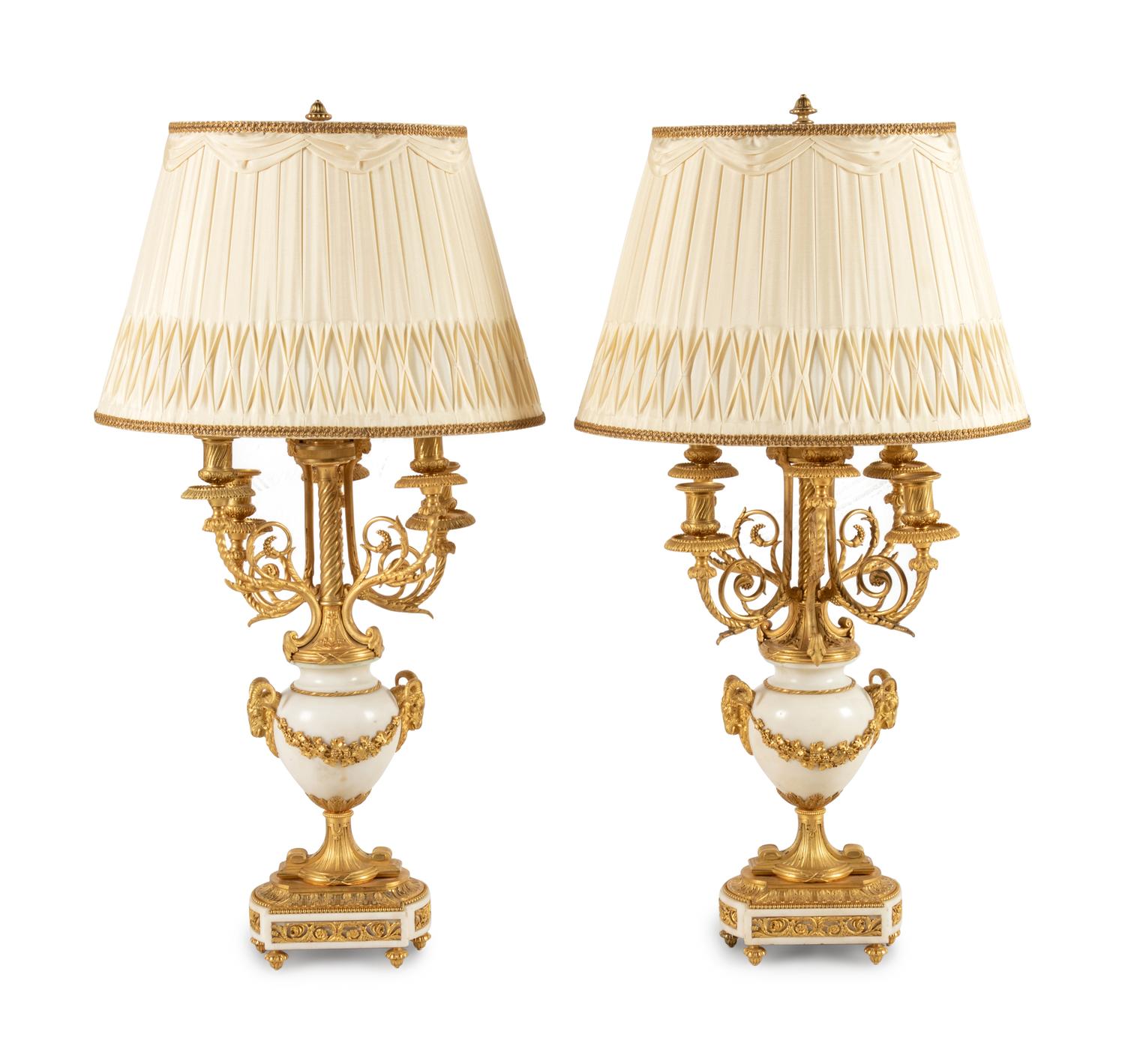 A Pair of Louis XVI Style Gilt Bronze and White Marble Six-Light Candelabra