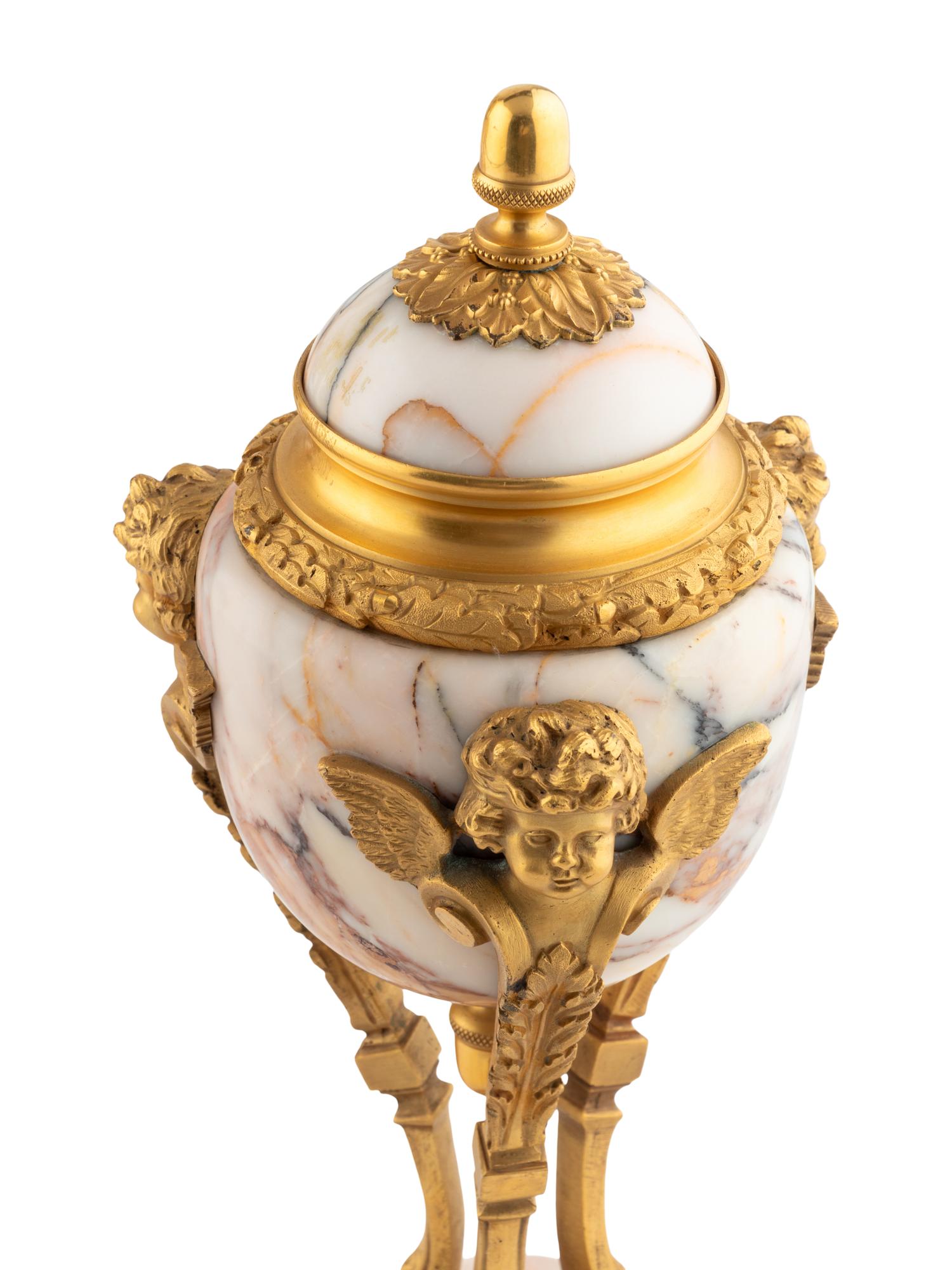 A French Gilt Bronze and Marble Mantel Clock Garniture