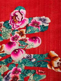 Two Chinese Red Ground Embroidered Silk 'Longevity' Panels