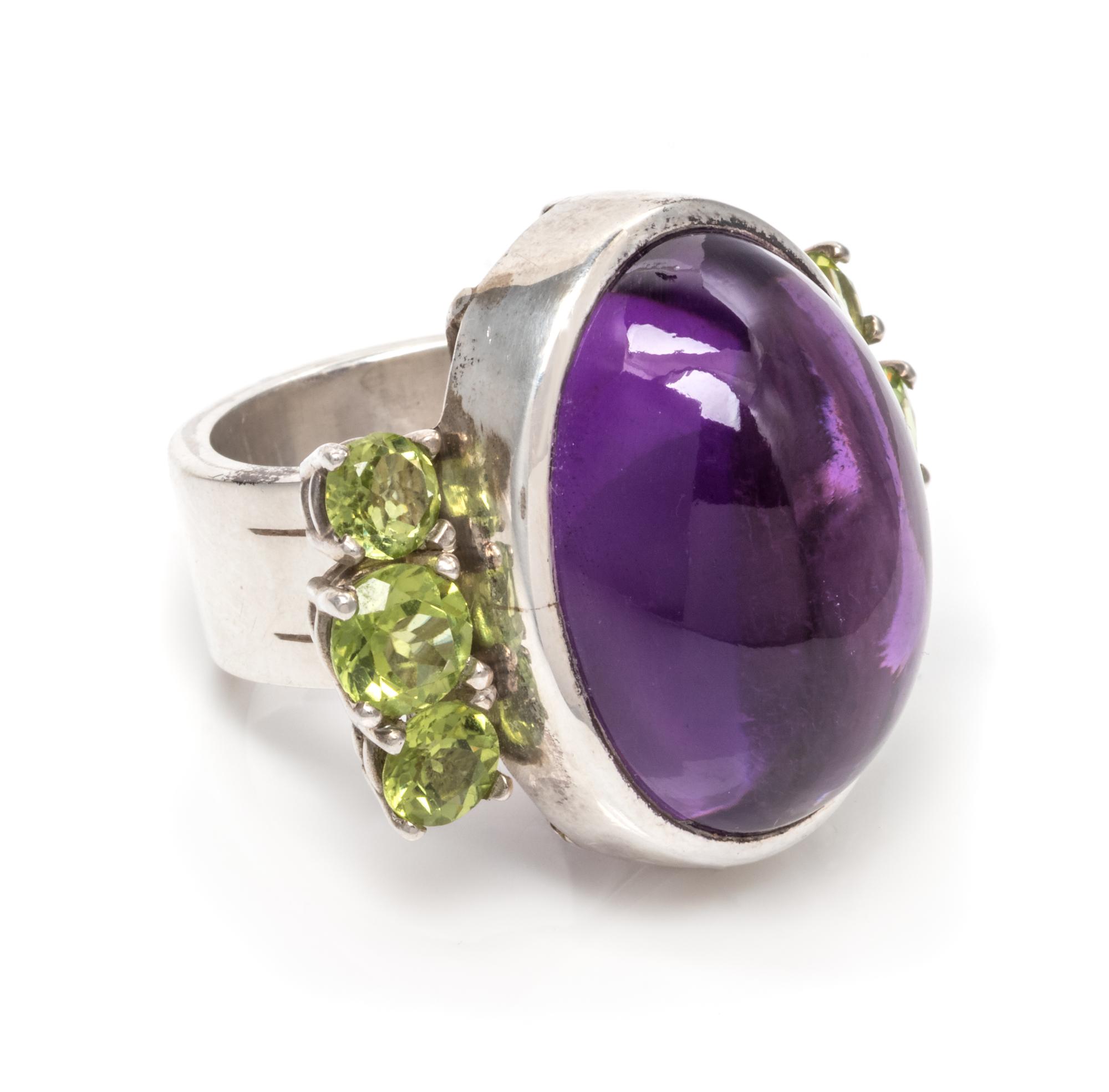 A Silver, Amethyst and Peridot Ring, 17.95 dwts.