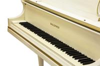 A Baldwin White Painted and Parcel Gilt Baby Grand Piano