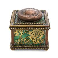 A Tiffany Studios Gilt Bronze and Favrile Glass Inkwell, Width 3 1/4 inches.