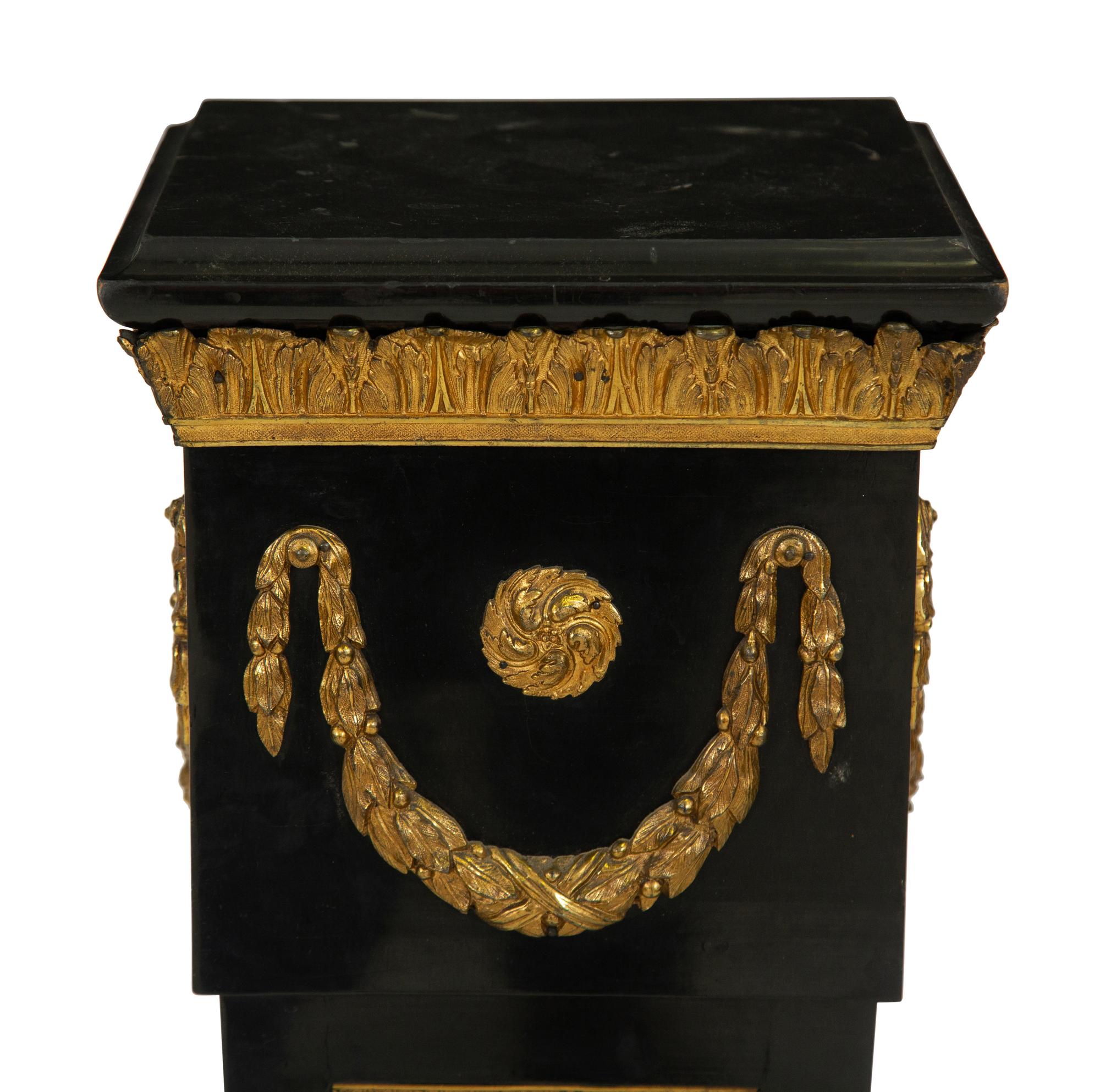 A Napoleon III Style Gilt Bronze Mounted Ebonized Pedestal