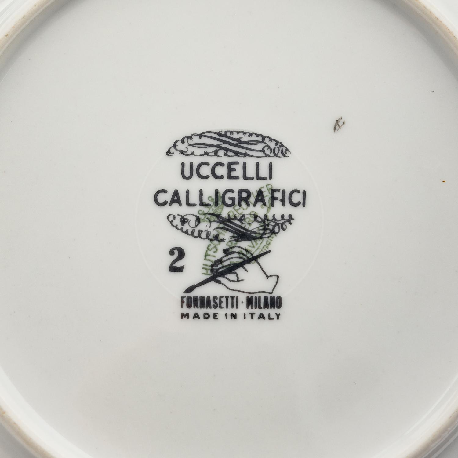 A Set of Eight Piero Fornasetti Uccelli Calligrafici Salad Plates