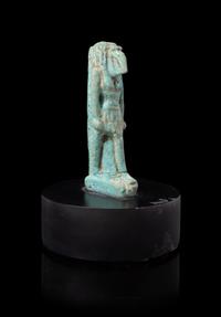 An Egyptian Faience Amulet of Thoth Height 2 1/8 inches. — PTOLEMAIC PERIOD, 304-30 B.C.E.