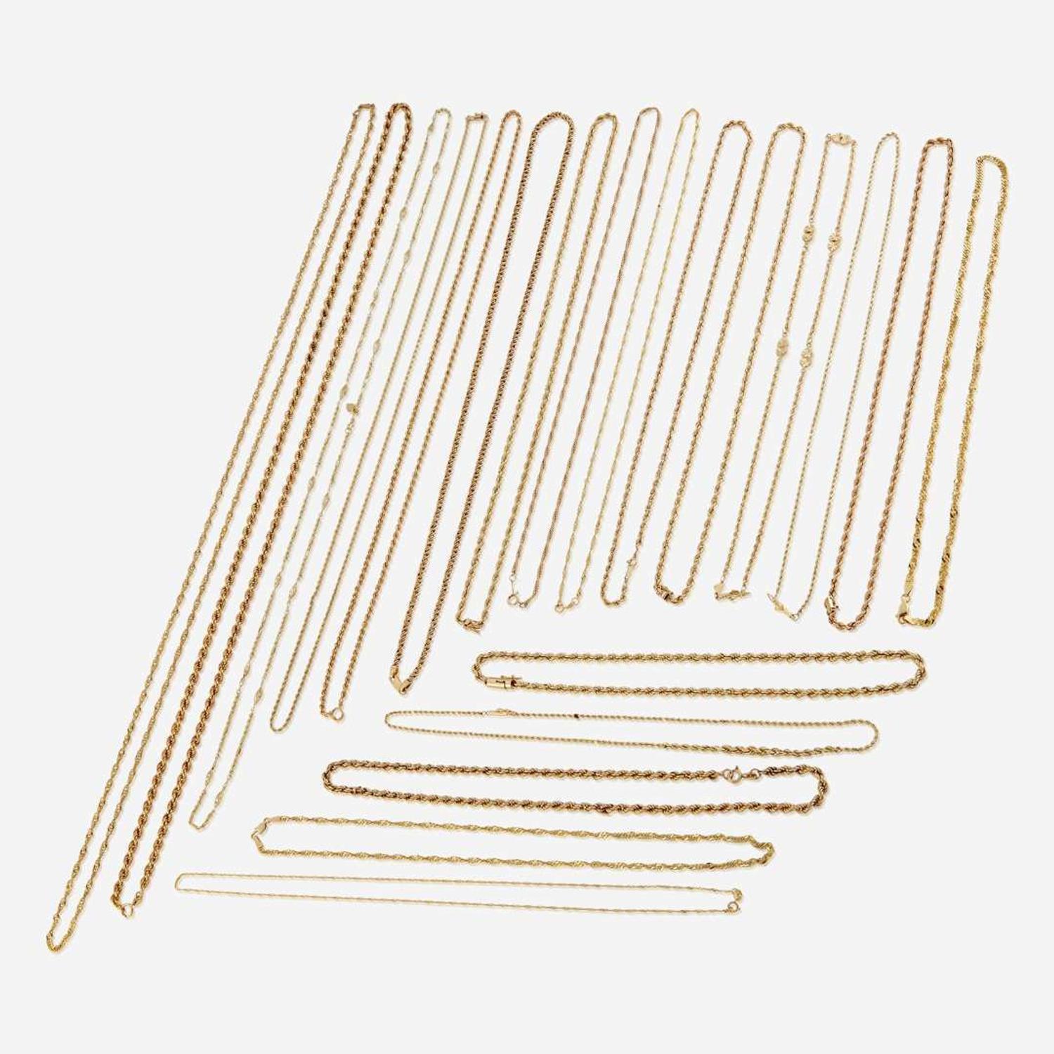 A collection of twenty fourteen karat gold necklaces