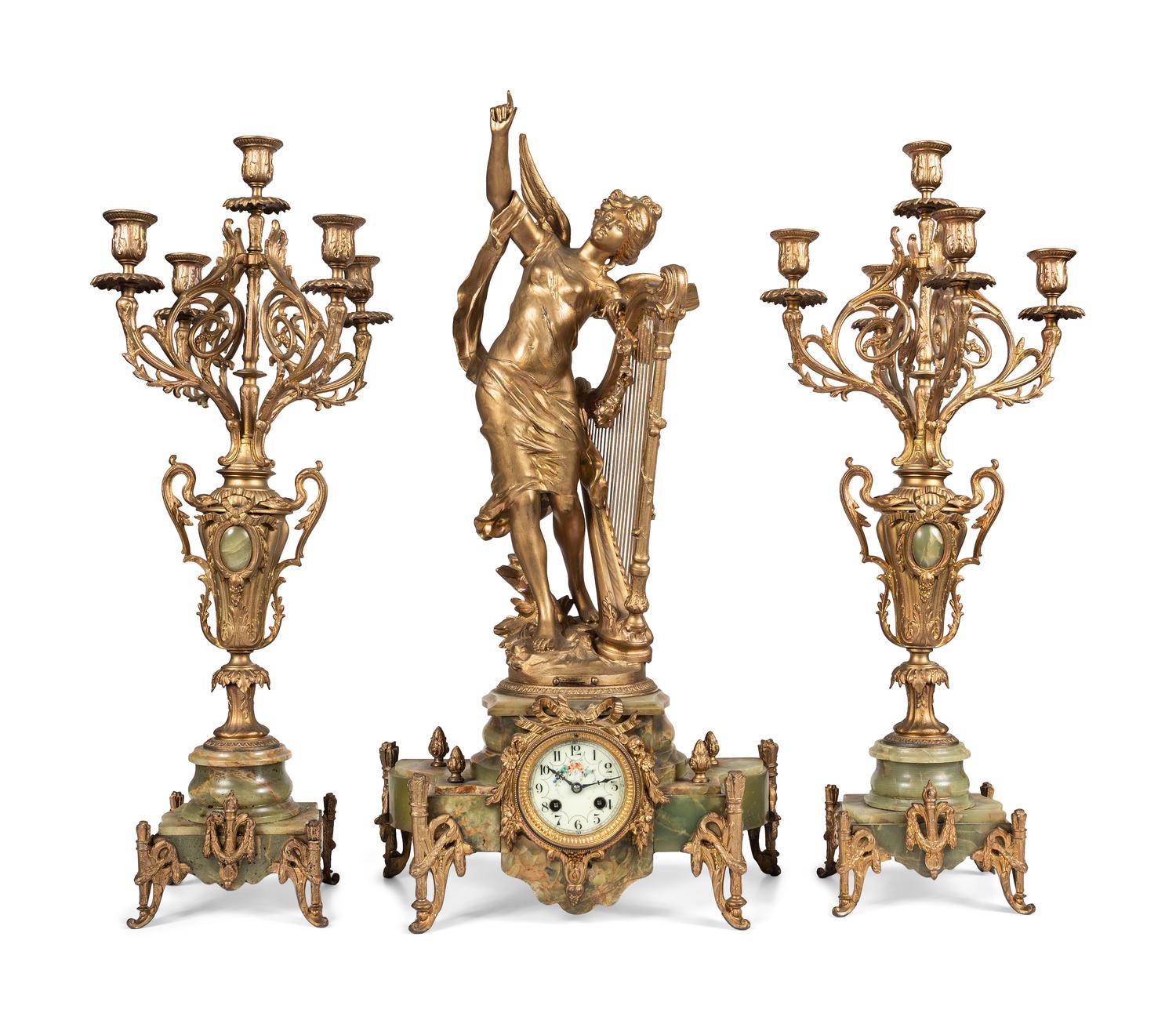 A Neoclassical Gilt Metal and Onyx Clock Garniture
