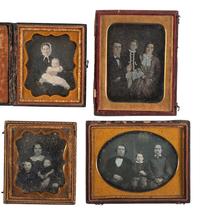 [EARLY PHOTOGRAPHY]. A group of 22 daguerreotype and tintype portraits of parents with children, including: