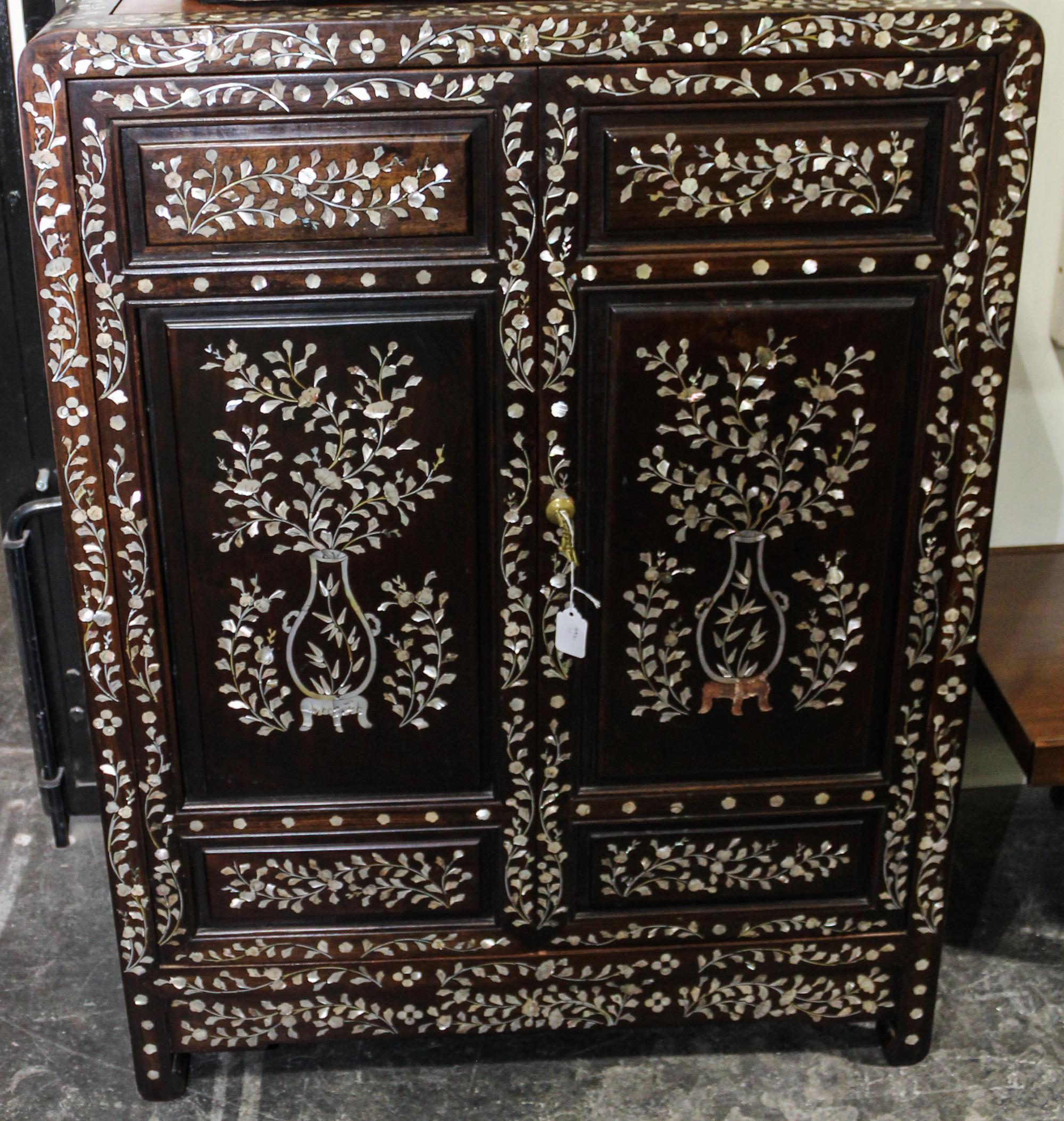A Chinese Mother-of-Pearl Inlaid Hardwood Cabinet Height 40 x width 29 3/4 x depth 16 inches. — 20TH CENTURY