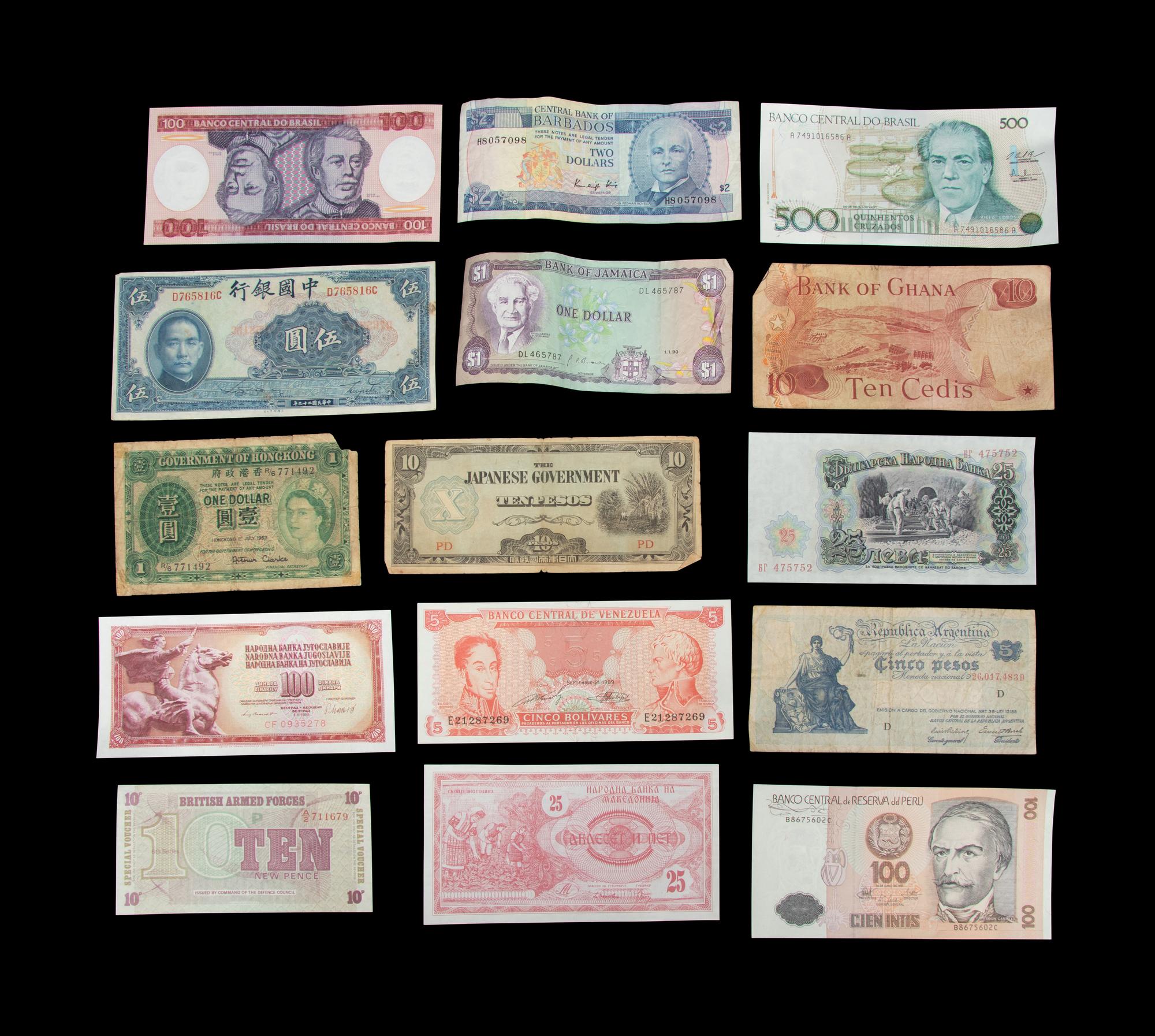 A Large Collection of International Coins and Paper Money