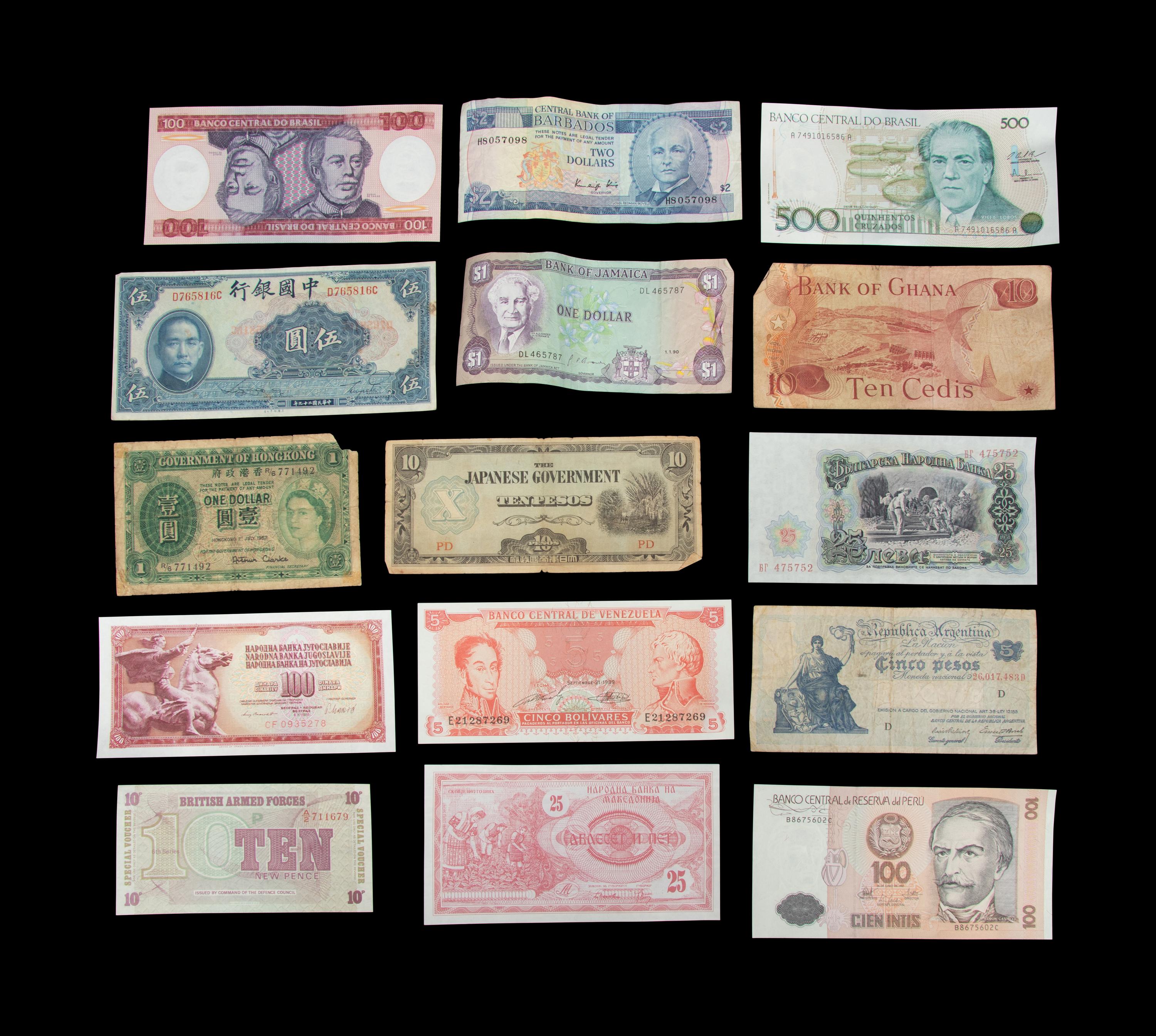 A Large Collection of International Coins and Paper Money
