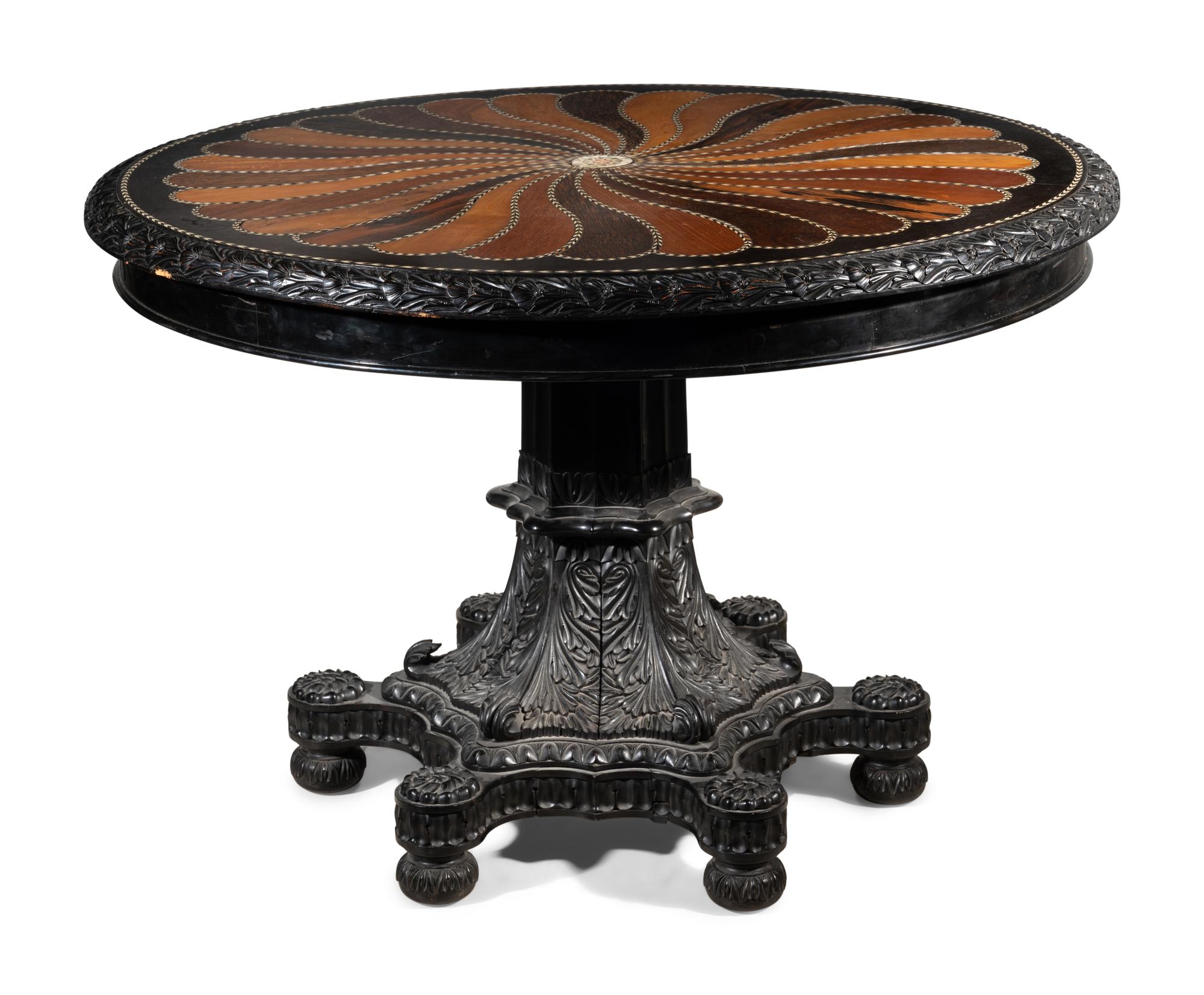 An Anglo-Colonial Carved and Specimen Woods Inlaid Tilt-Top Breakfast Table