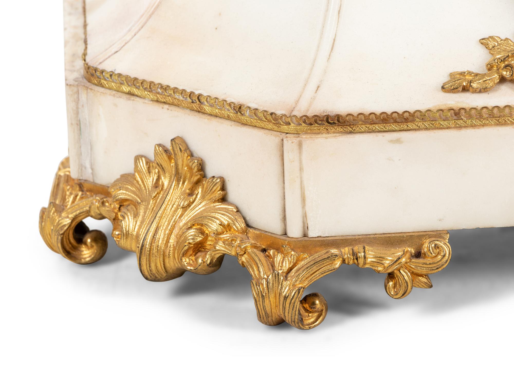 A French Gilt and Patinated Bronze Mounted Marble Mantel Clock