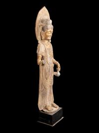 A Chinese Carved Stone Guanyin with Lotus Crown and Remnants of Gilt