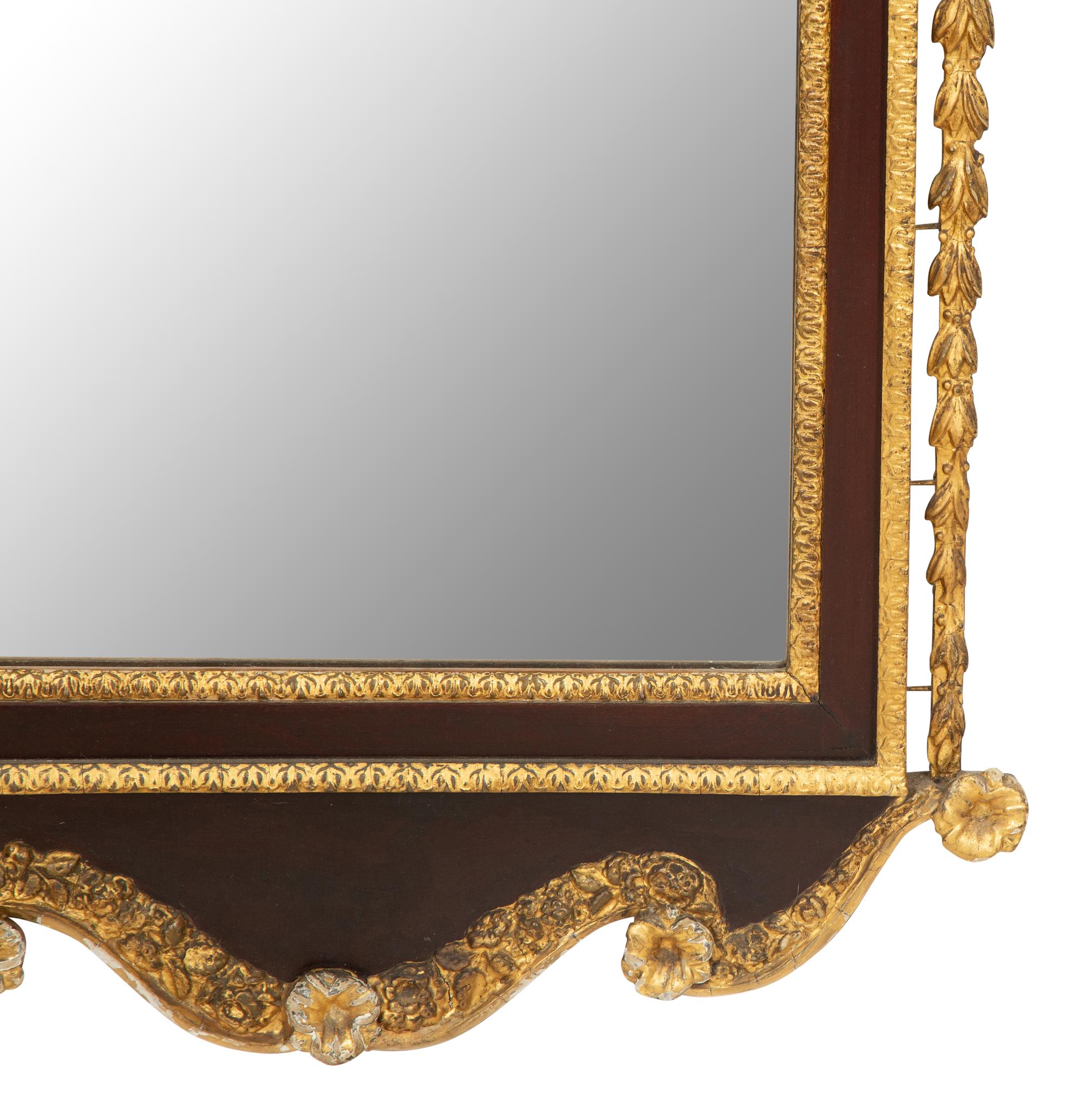 A George III Style Parcel Gilt Mahogany Mirror