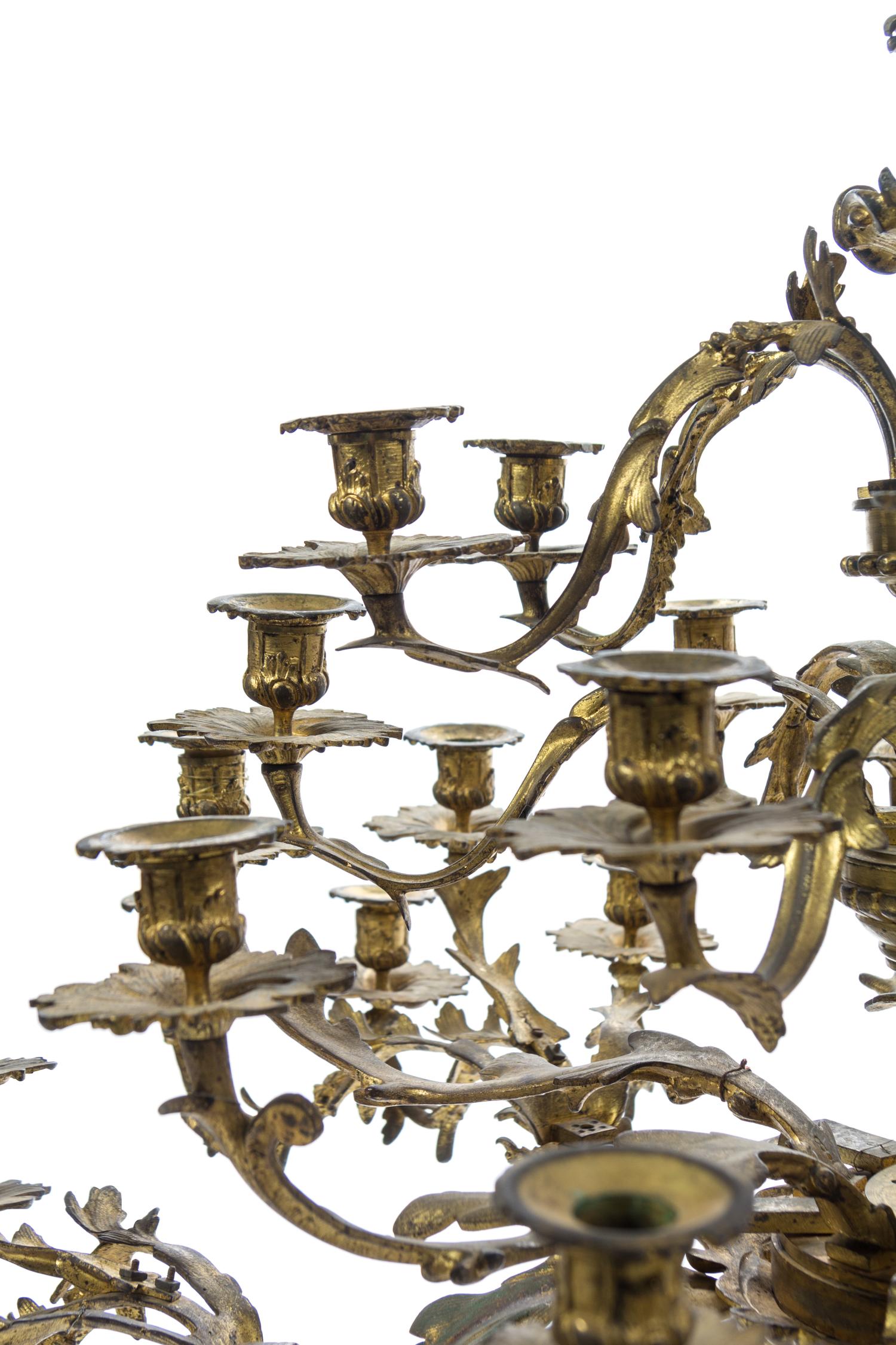 A Louis XV Style Gilt Bronze Forty-Two Light Chandelier Height 50 x width 44 inches. — LATE 19TH CENTURY
