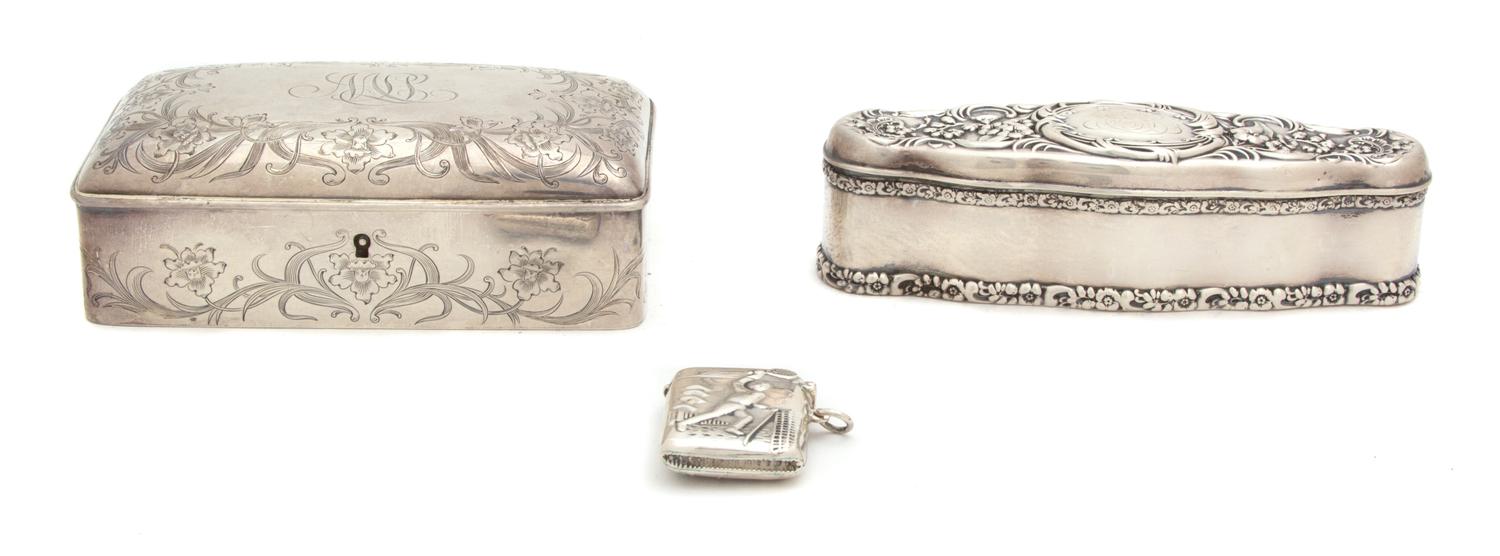 Three American Silver Boxes, Various Makers, a rectangular box with monogrammed top, an elongated oval box with chased floral decoratio