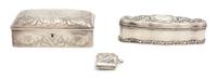 Three American Silver Boxes, Various Makers, a rectangular box with monogrammed top, an elongated oval box with chased floral decoratio