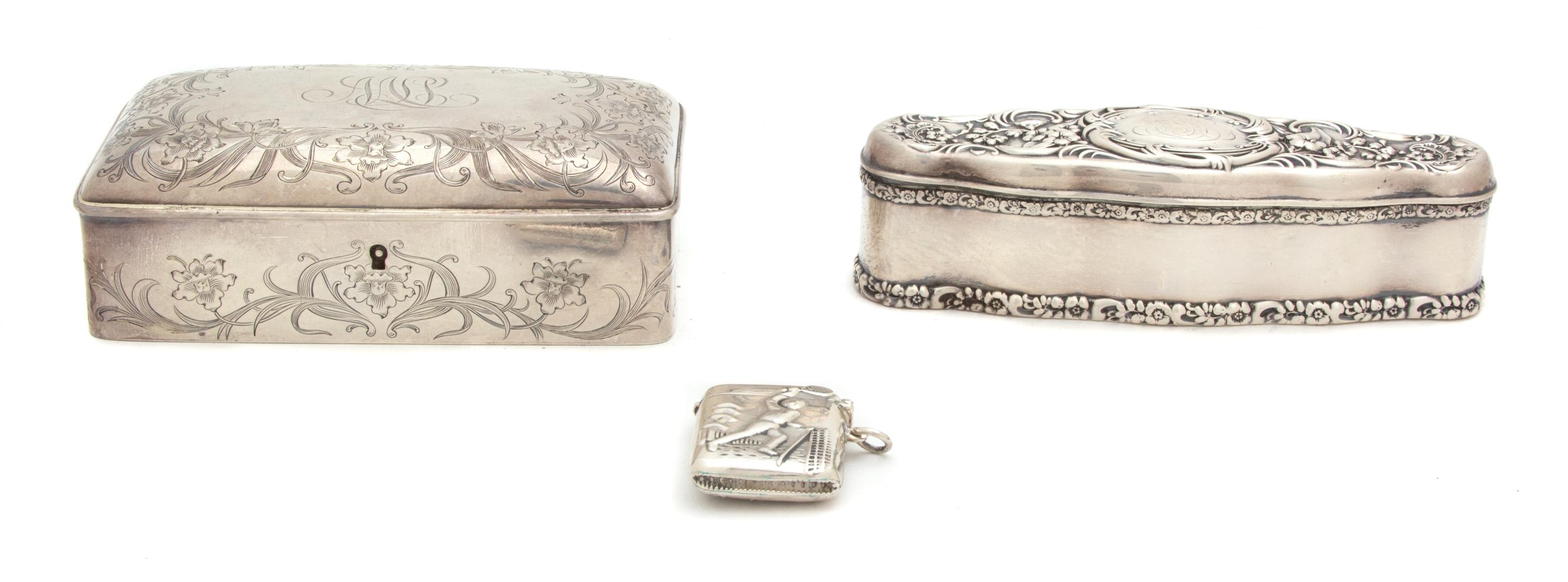 Three American Silver Boxes, Various Makers, a rectangular box with monogrammed top, an elongated oval box with chased floral decoratio