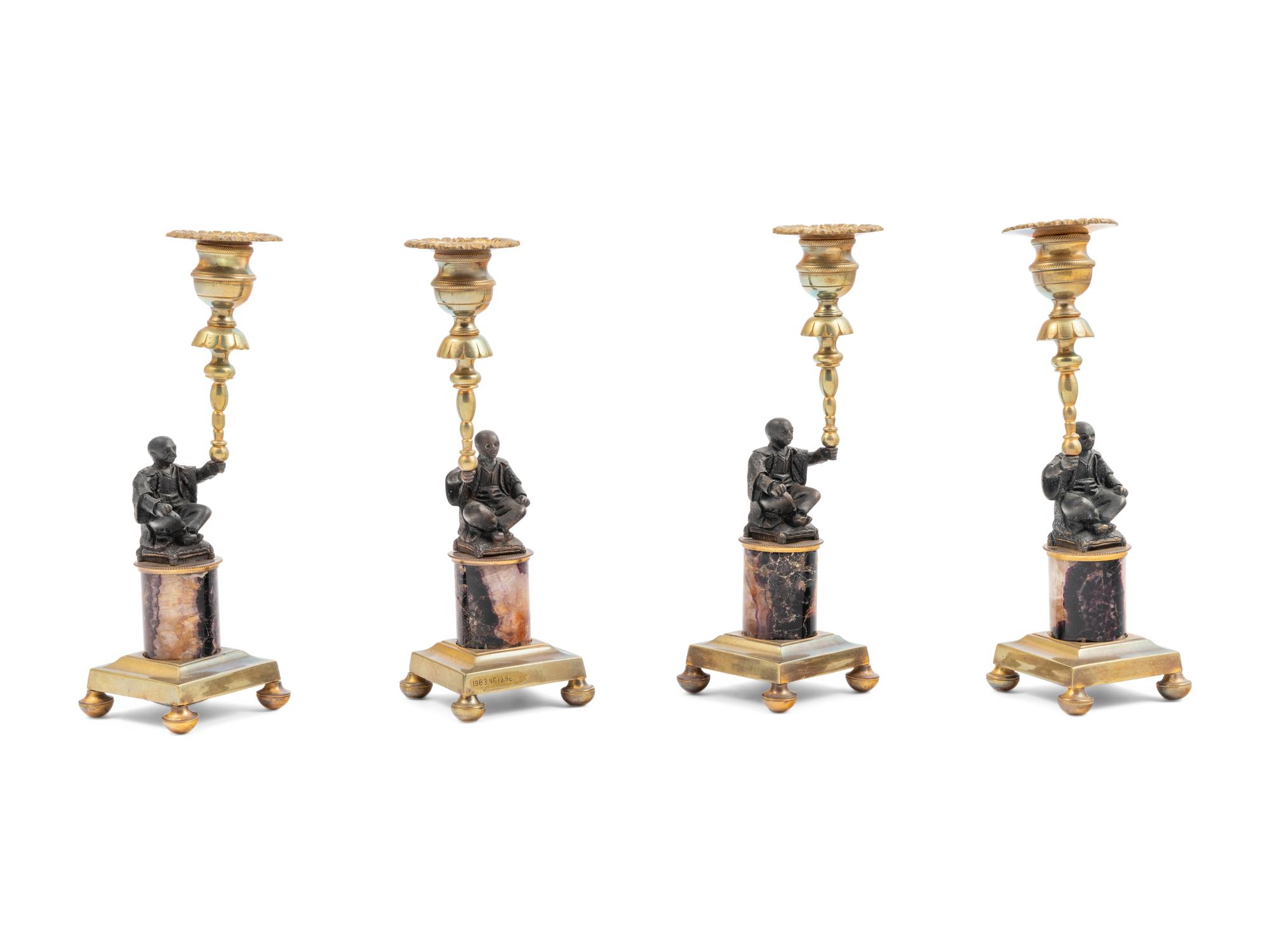 A Set of Four Gilt Metal and 'Blue John' Figural Candlesticks