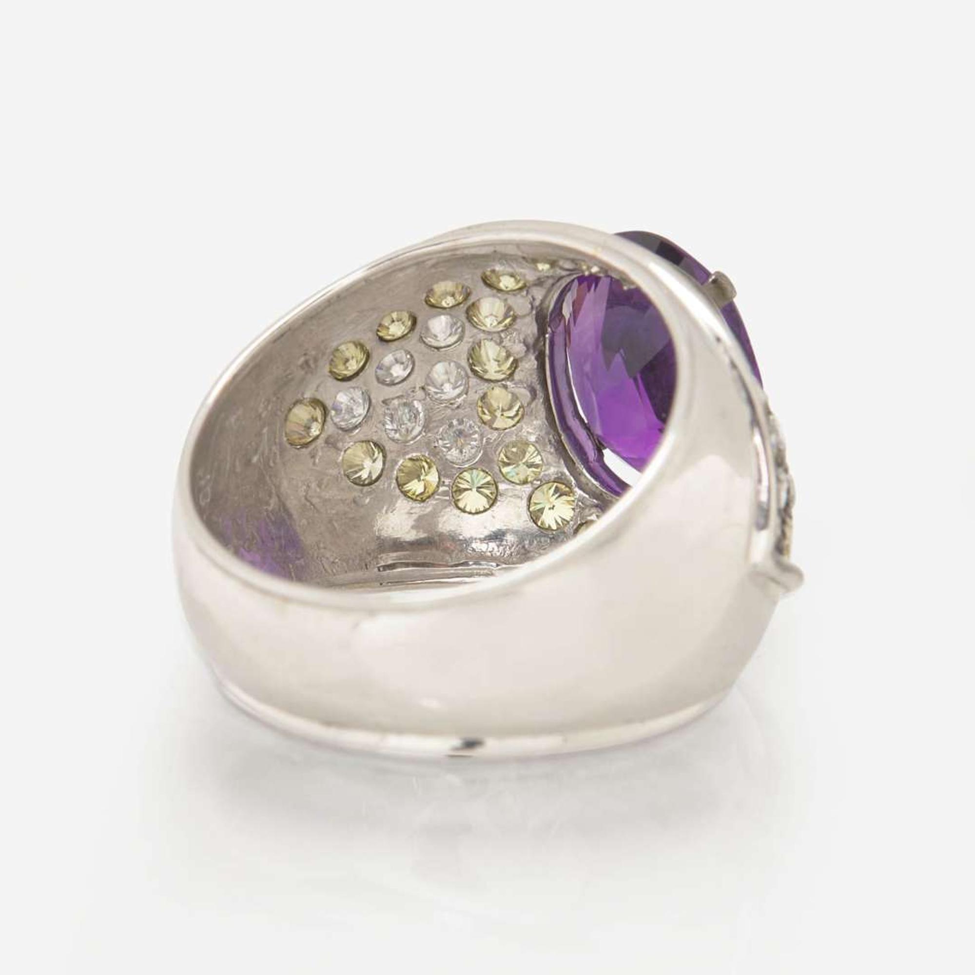 An Amethyst, Diamond, and Yellow Diamond Ring
