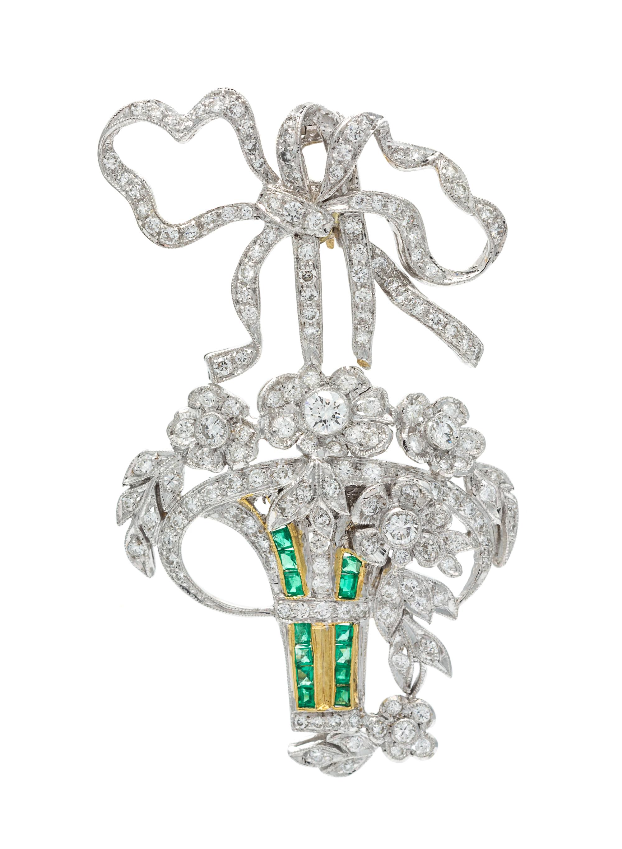 An 18 Karat White Gold, Diamond and Emerald Pendant/Brooch, 8.40 dwts.