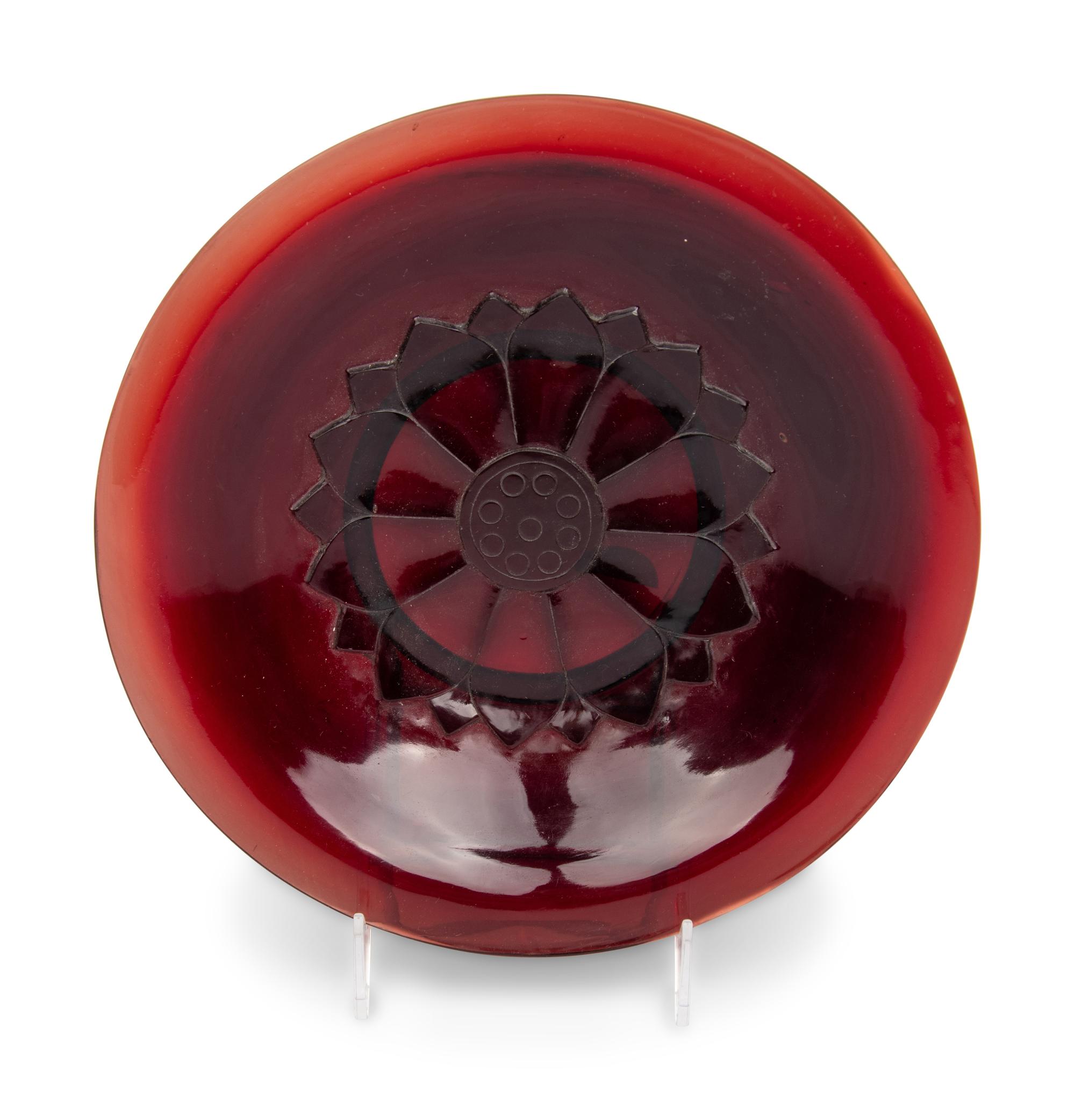 A Chinese Carved Ruby Red 'Lotus' Peking Glass Plate, Late 19th-Early 20th Century 晚清-民國 寶石紅料蓮紋賞盤
