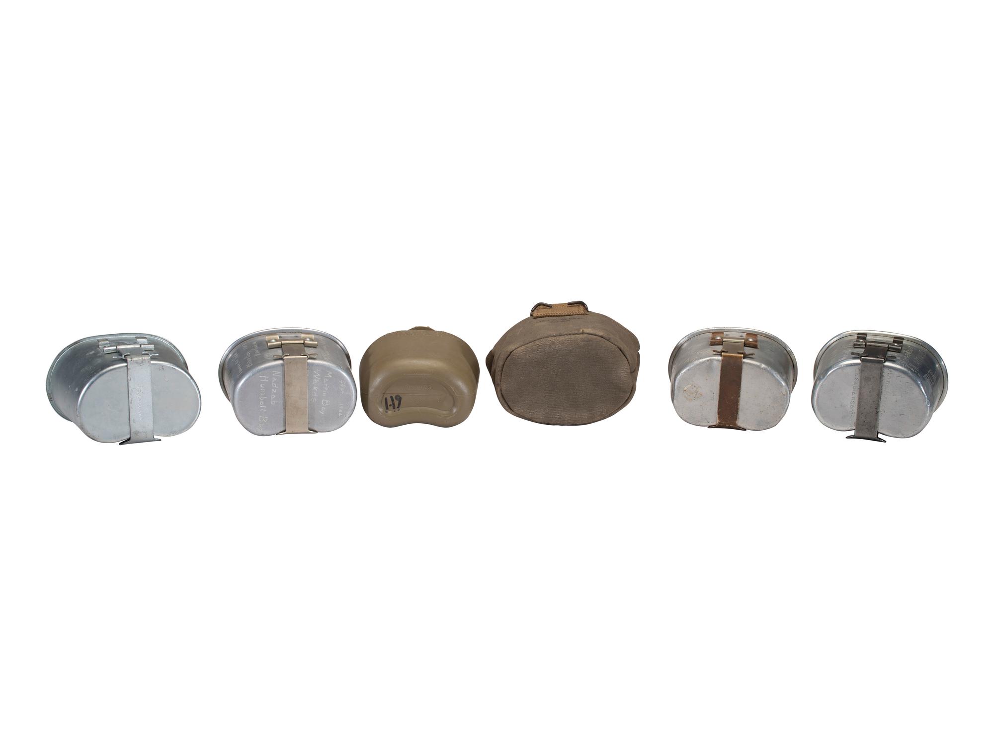 [MILITARIA]. World War II and Korean War-era canteens, canteen covers, and mess kits.