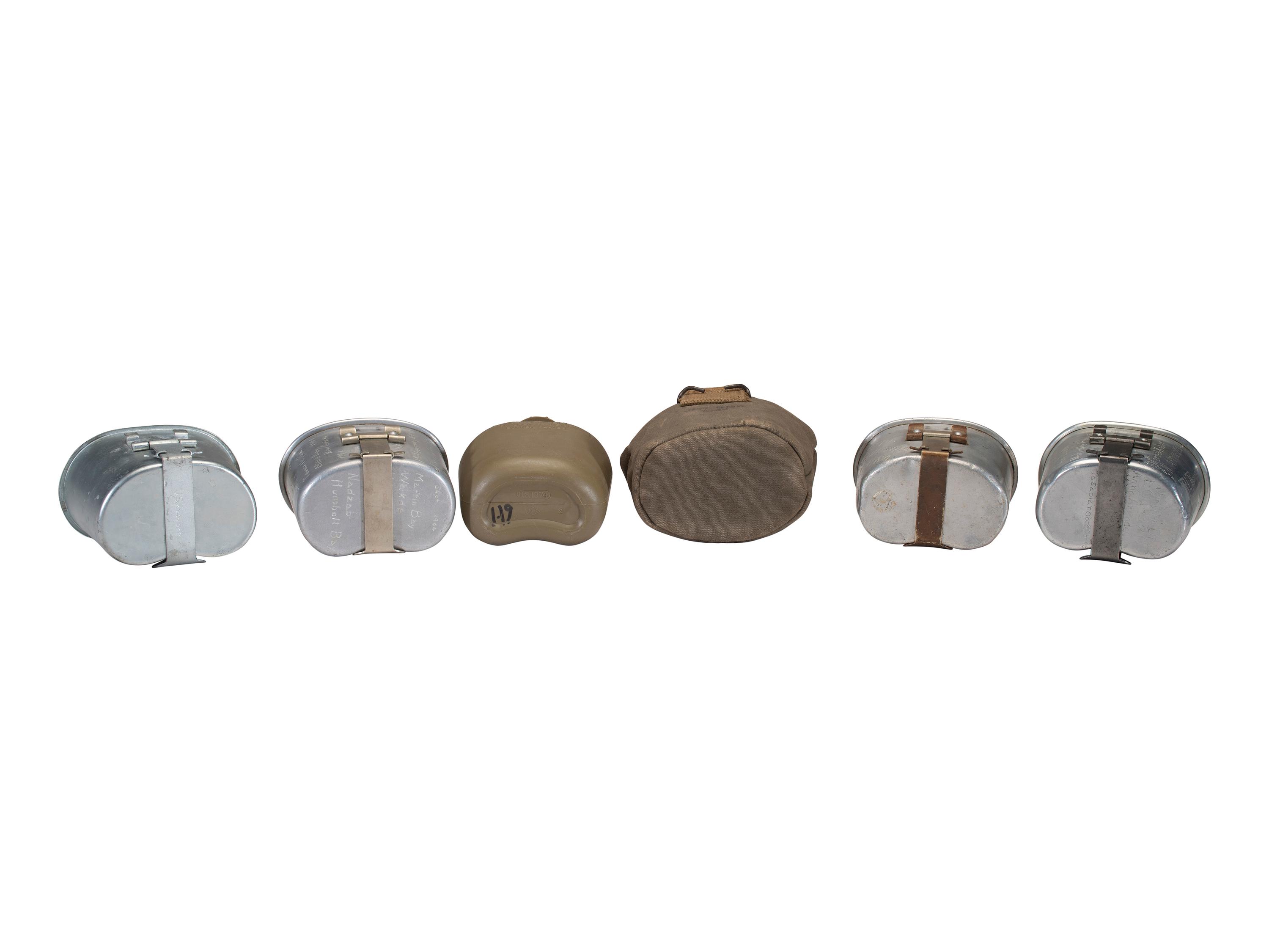 [MILITARIA]. World War II and Korean War-era canteens, canteen covers, and mess kits.