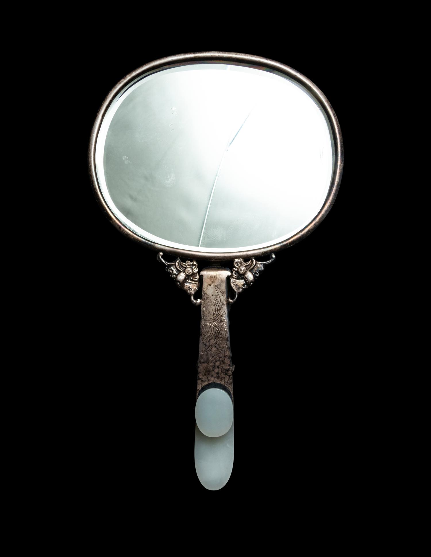 A White and Celadon Jade Mounted Silver Hand Mirror