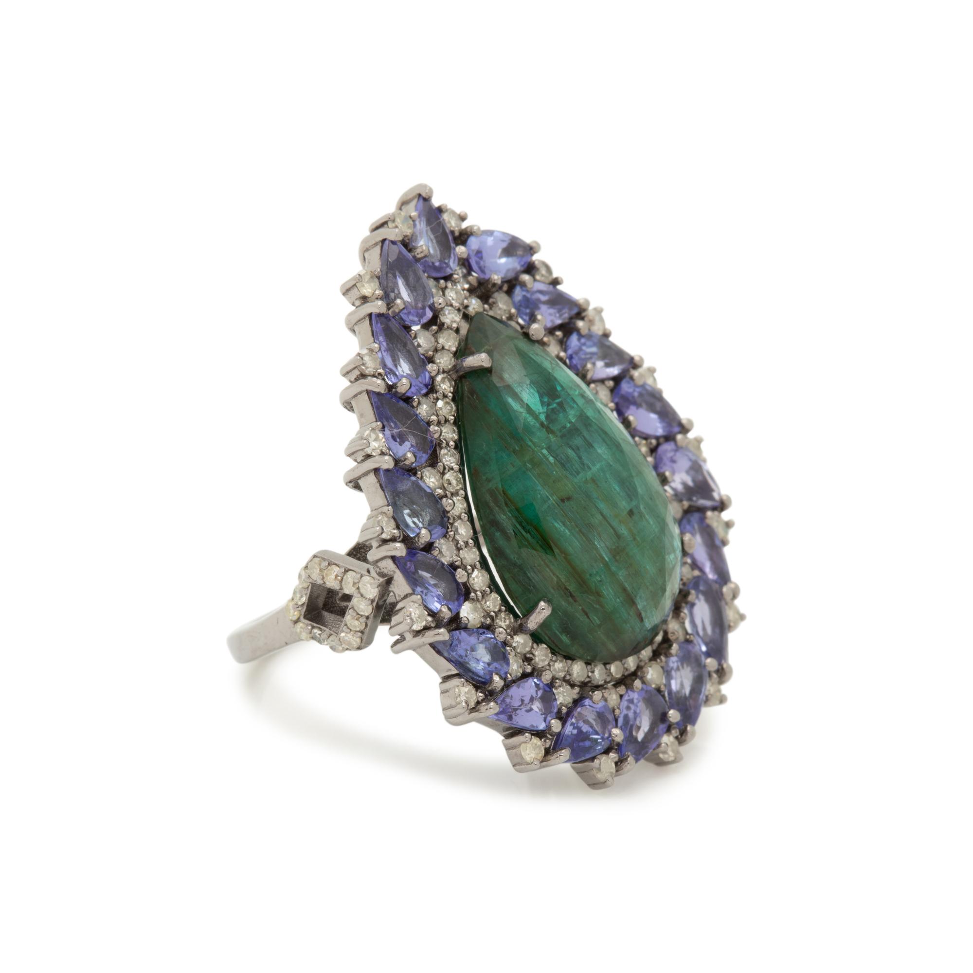 EMERALD, TANZANITE AND DIAMOND RING