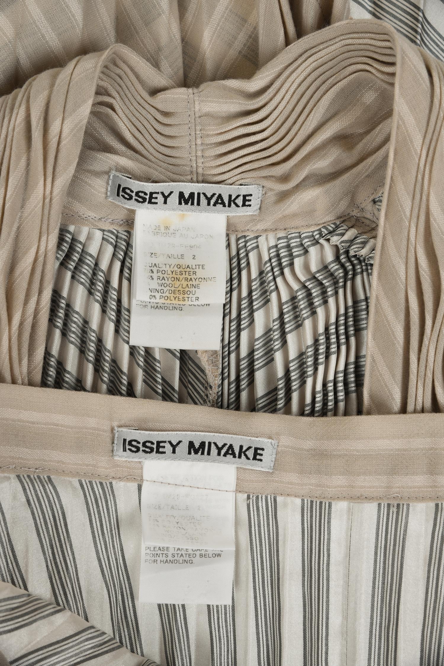 Two Issey Miyake Ensembles: One Two-Piece Pleated Ensemble and One Printed Dress