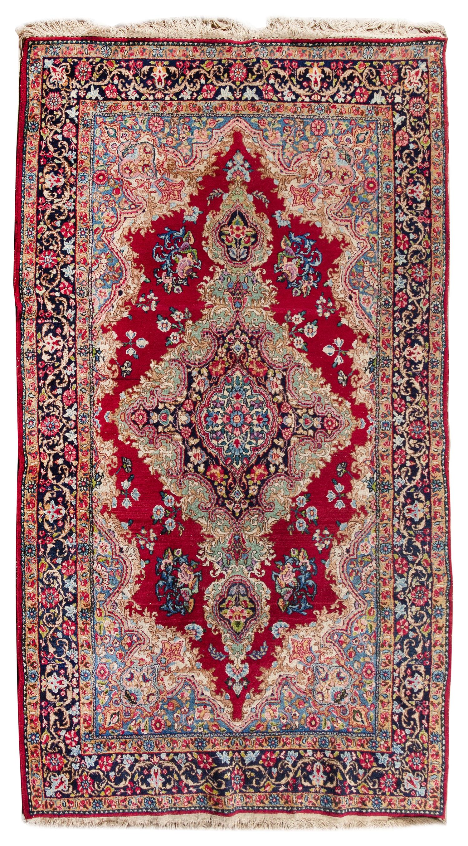 A Kirman Wool Rug 6 feet 9 inches x 3 feet 10 inches. — 20TH CENTURY
